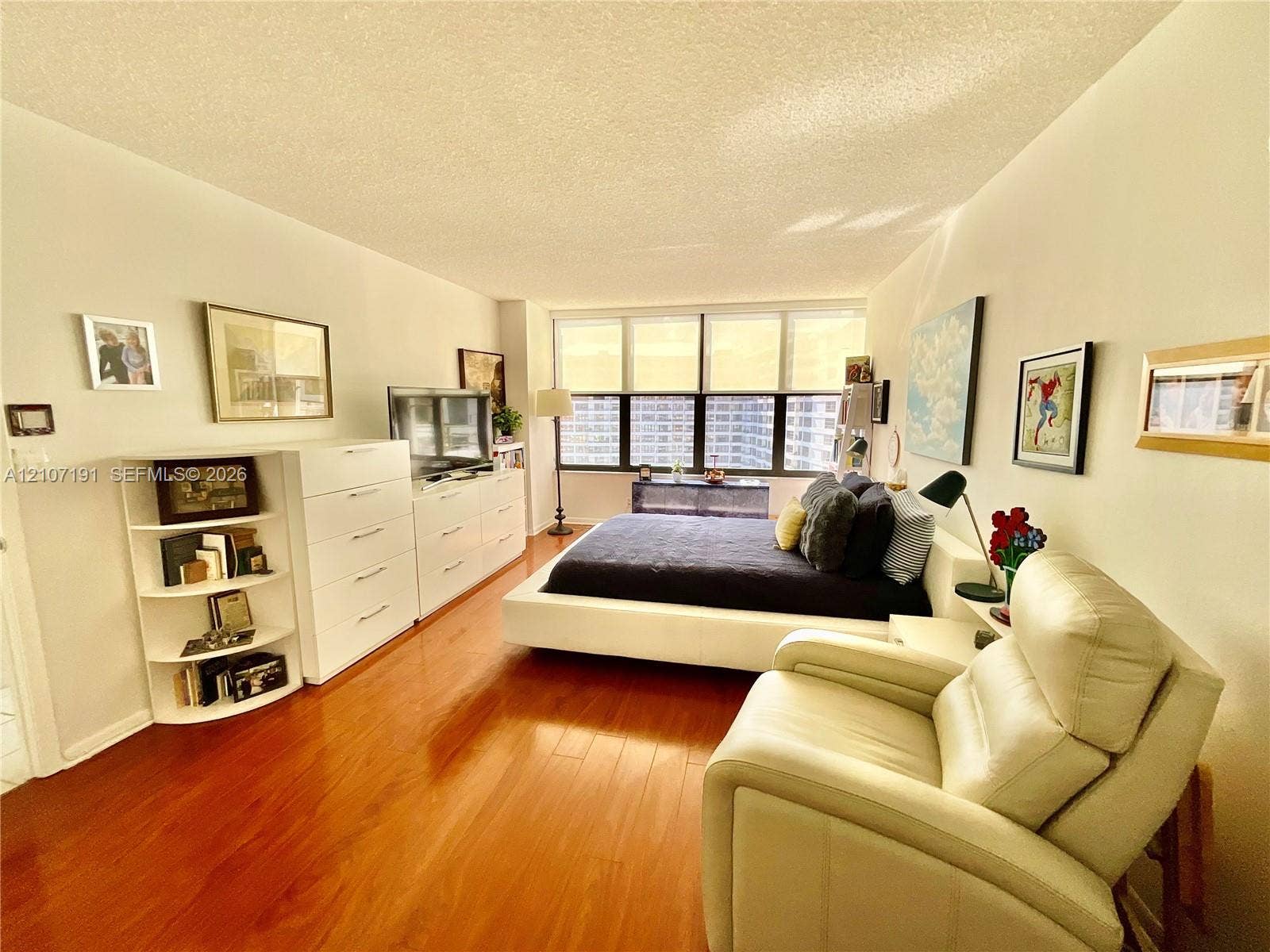 Wood-finish flooring and expansive floor-to-ceiling windows
