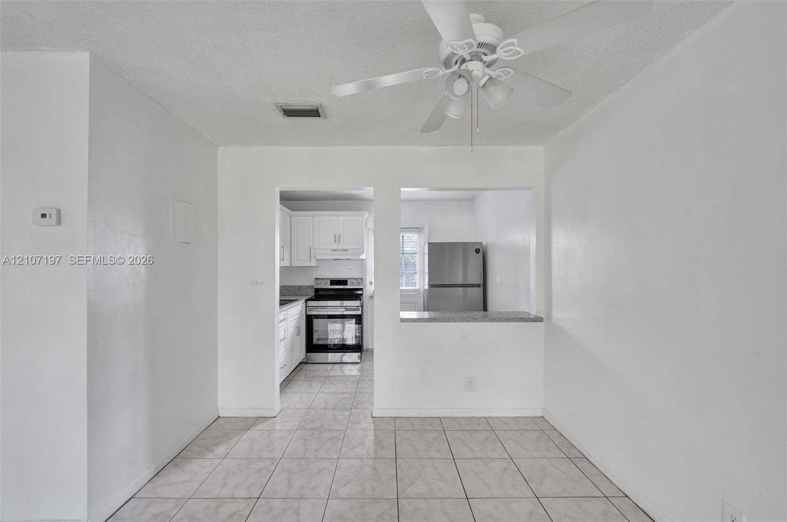 10301 NW 36th Street, #6, Coral Springs, Coral Springs, FL 33065 Interior space featuring tile flooring and a ceiling-mounted light fixture with a fan