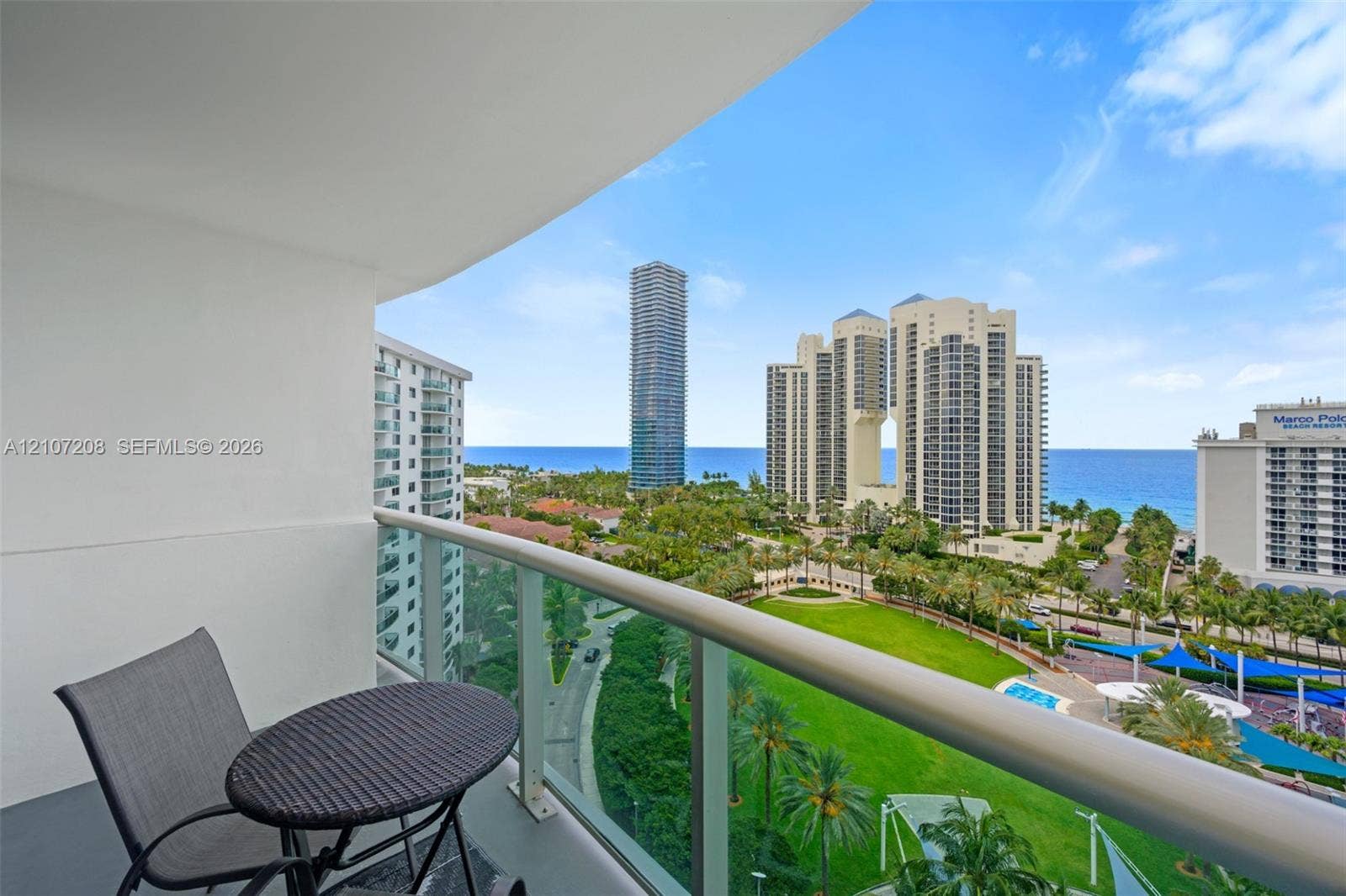 19370 Collins Avenue, #1405, Sunny Isles Beach, Sunny Isles Beach, FL 33160 Private balcony with glass panel railing and painted concrete flooring