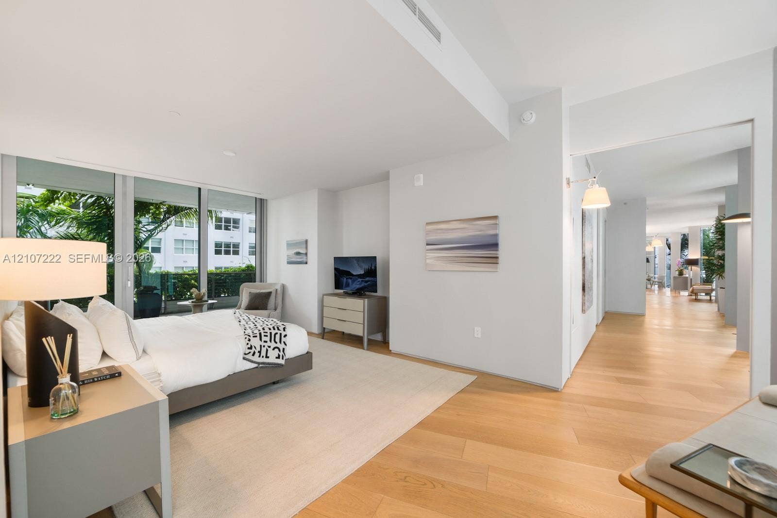 1300 Monad Terrace, #2F, Miami Beach, FL 33139 Floor-to-ceiling windows, wood-finish flooring, and recessed ceiling lighting