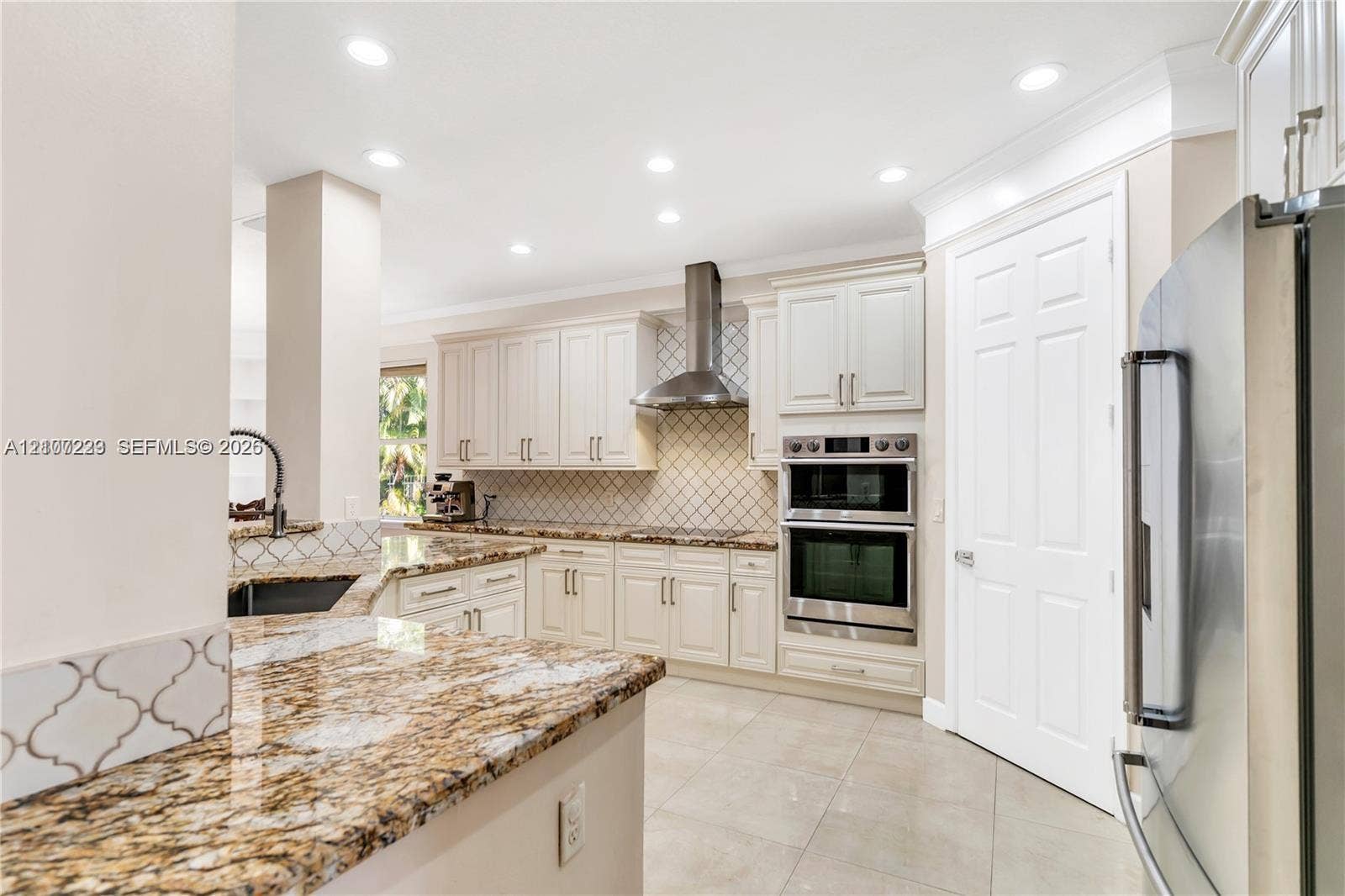 5280 NW 95th Avenue, Coral Springs, Coral Springs, FL 33076 Kitchen featuring off-white cabinetry, stone countertops, a tiled backsplash, stainless steel double wall ovens, and recessed lighting