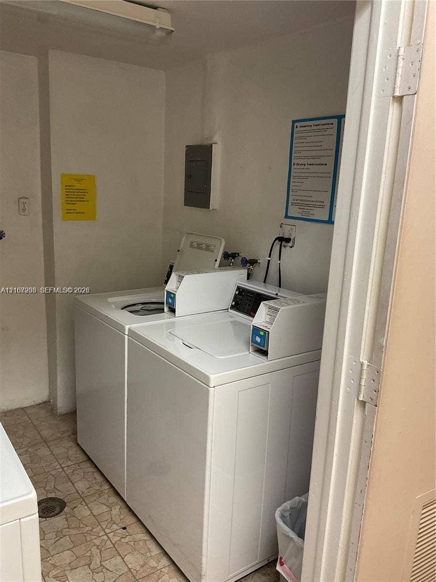 215 SE 3rd Avenue, #102D, Hallandale Beach, Hallandale Beach, FL 33009 Utility area featuring white top-loading laundry appliances and ceramic tile flooring