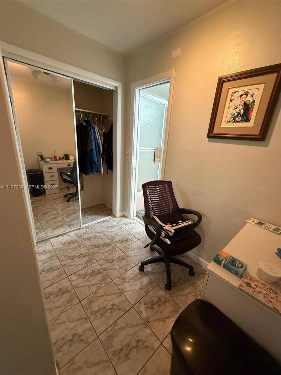 215 SE 3rd Avenue, #102D, Hallandale Beach, Hallandale Beach, FL 33009 Tiled flooring throughout with sliding mirrored closet doors and built-in closet shelving