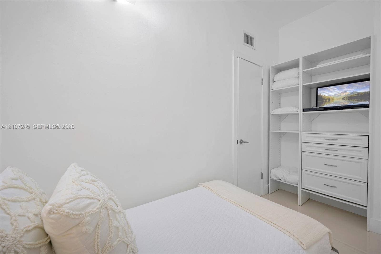19370 Collins Avenue, #PH-14, Sunny Isles Beach, Sunny Isles Beach, FL 33160 Built-in white storage cabinetry featuring open shelving and integrated drawers