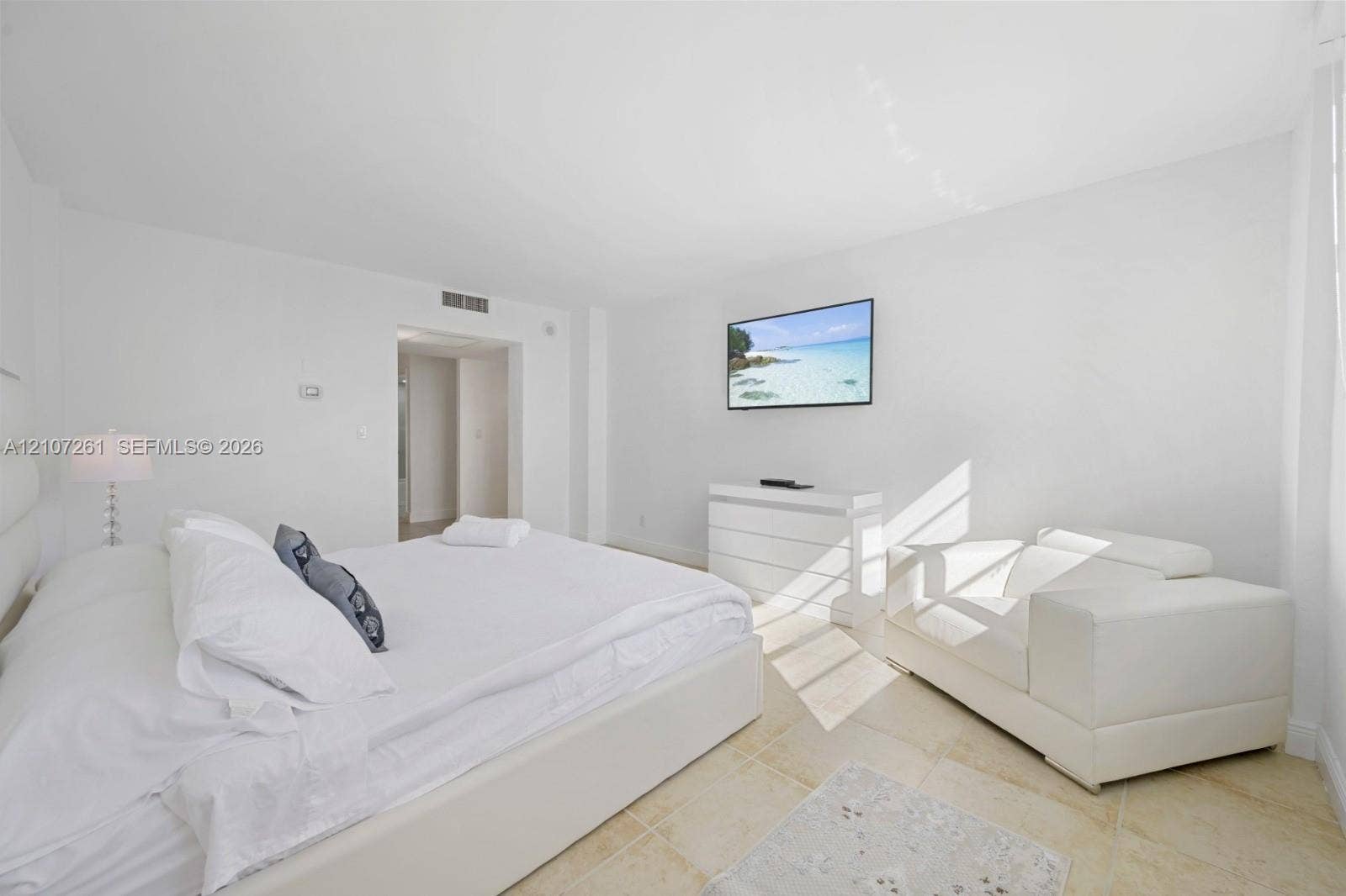 19370 Collins Avenue, #1601, Sunny Isles Beach, Sunny Isles Beach, FL 33160 Neutral-toned room with natural stone flooring and recessed ceiling lighting
