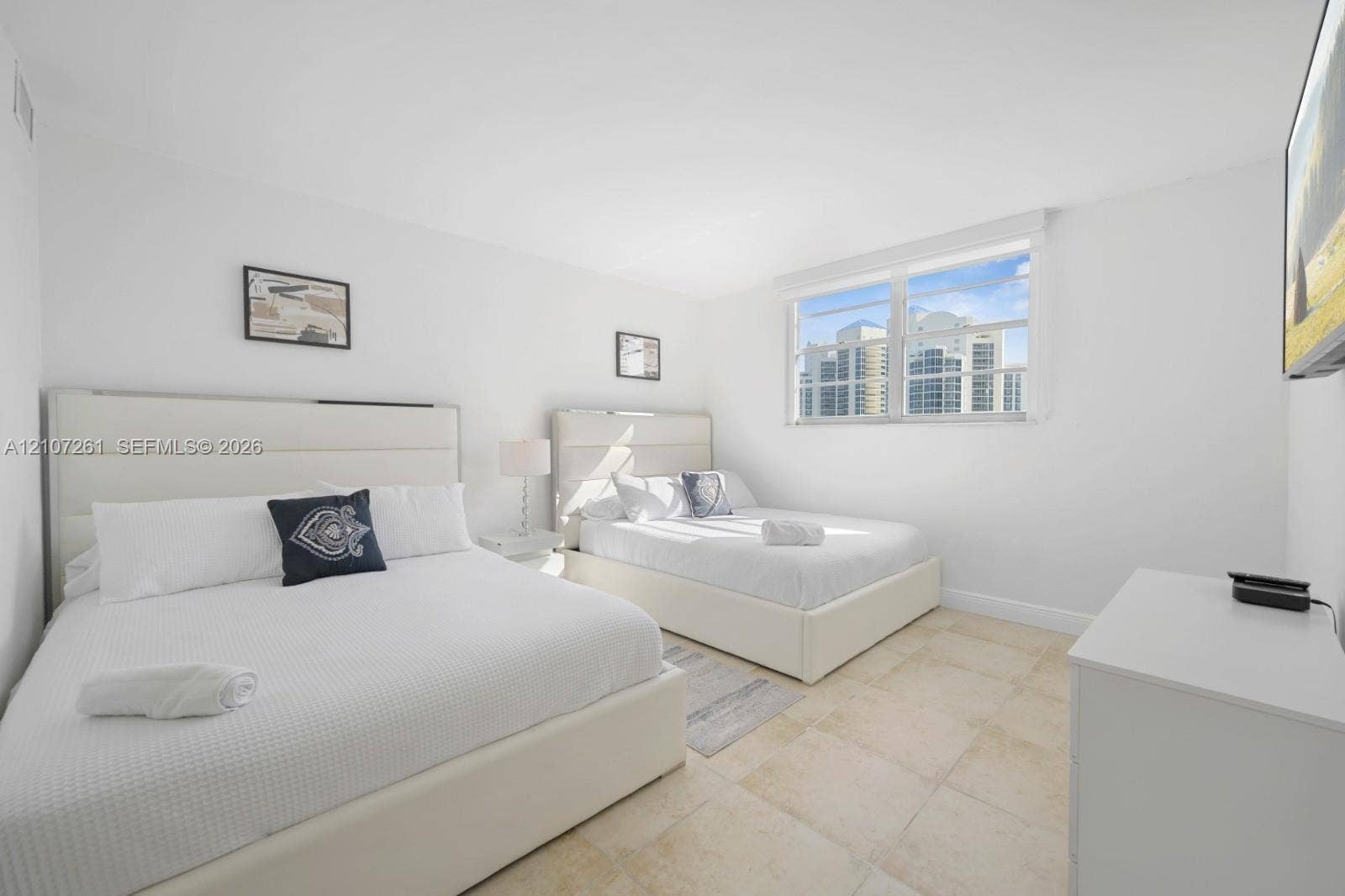 19370 Collins Avenue, #1601, Sunny Isles Beach, Sunny Isles Beach, FL 33160 Neutral-toned tile flooring, large multi-pane windows, and minimalist wall finishes