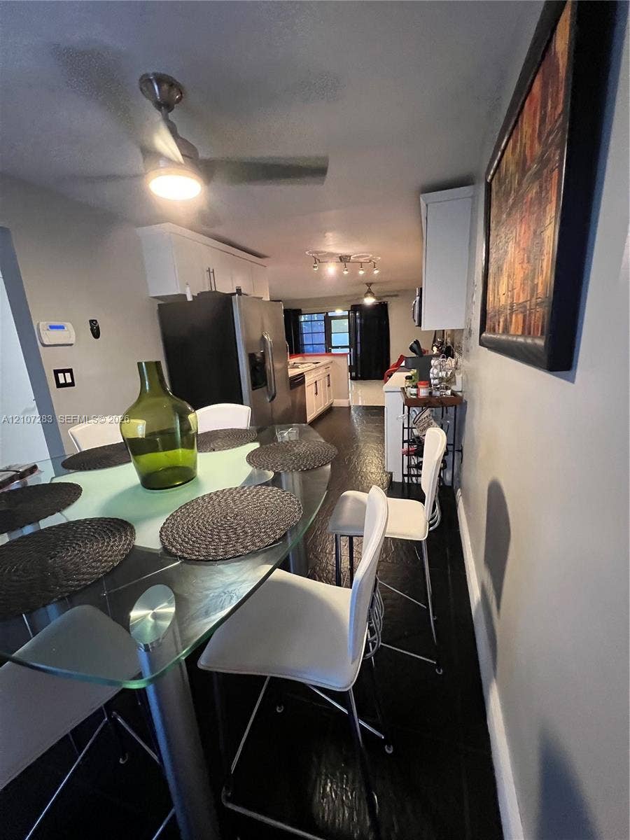 3301 Raleigh Street, #4E, Hollywood, FL 33021 Kitchen featuring stainless steel appliances, white cabinetry, dark flooring, and recessed ceiling lighting