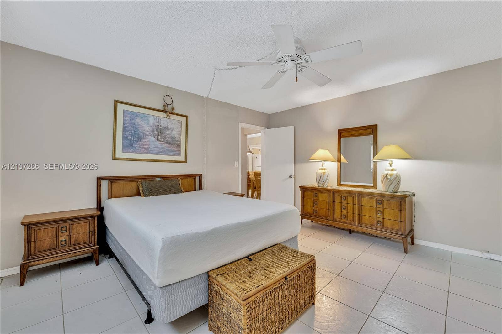2458 Polk Street, #206, Hollywood, FL 33020 Neutral wall tones, ceramic tile flooring, and a central ceiling fan