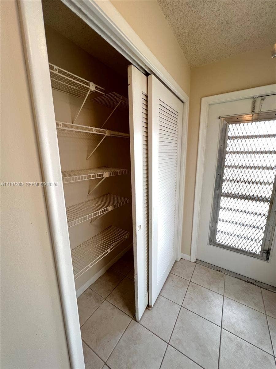 403 SW Natura Avenue, #F, Deerfield Beach, Deerfield Beach, FL 33441 extra closet in entry area