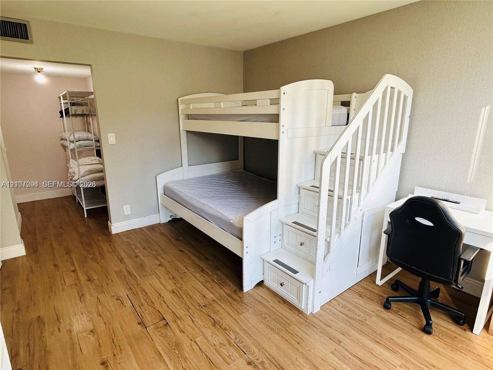 17021 N Bay Road, #219, Sunny Isles Beach, Sunny Isles Beach, FL 33160 Neutral-toned walls and wood-finish flooring
