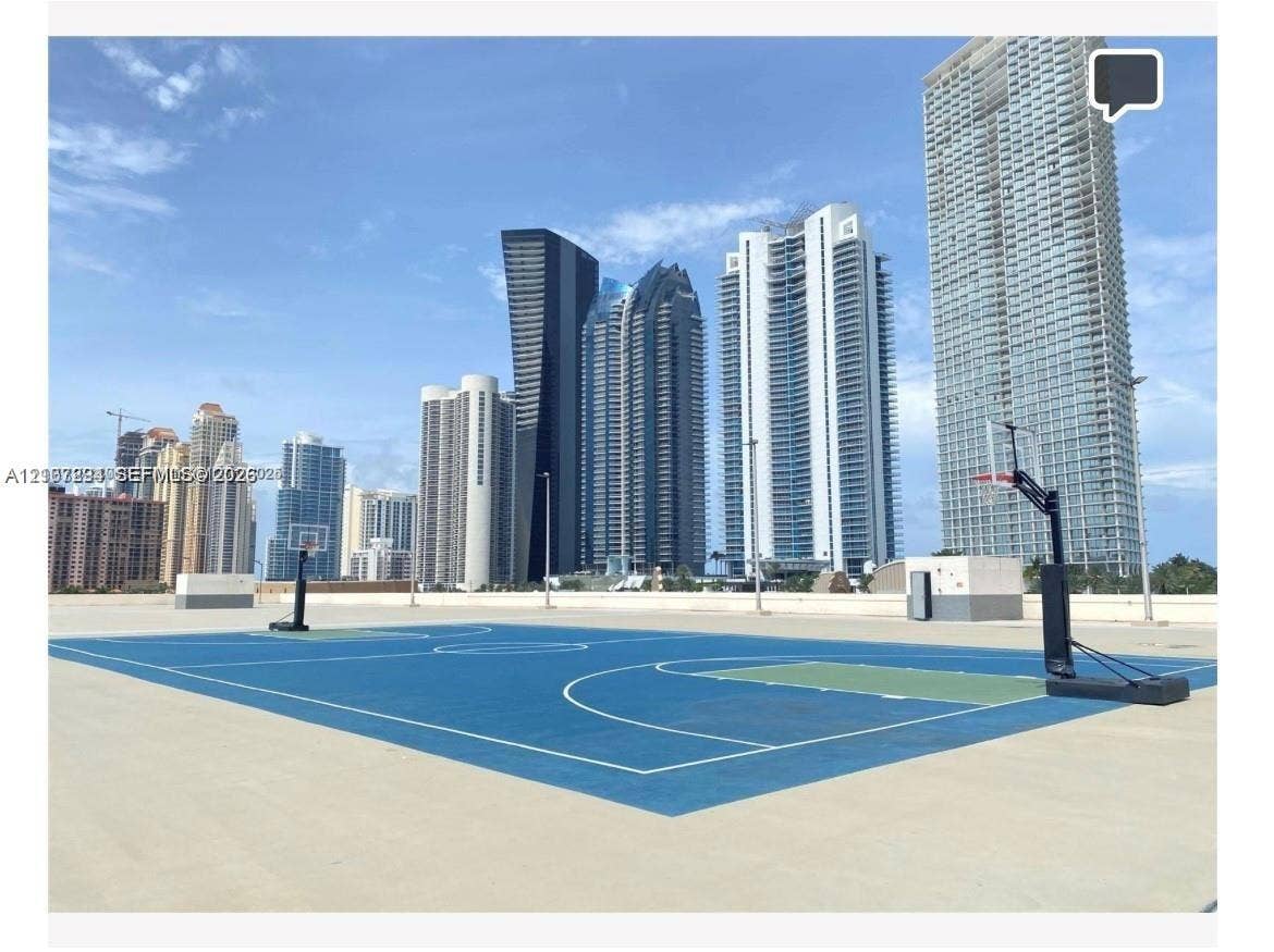 17021 N Bay Road, #219, Sunny Isles Beach, Sunny Isles Beach, FL 33160 Outdoor sport court featuring a hard surface, painted markings, and two basketball hoops