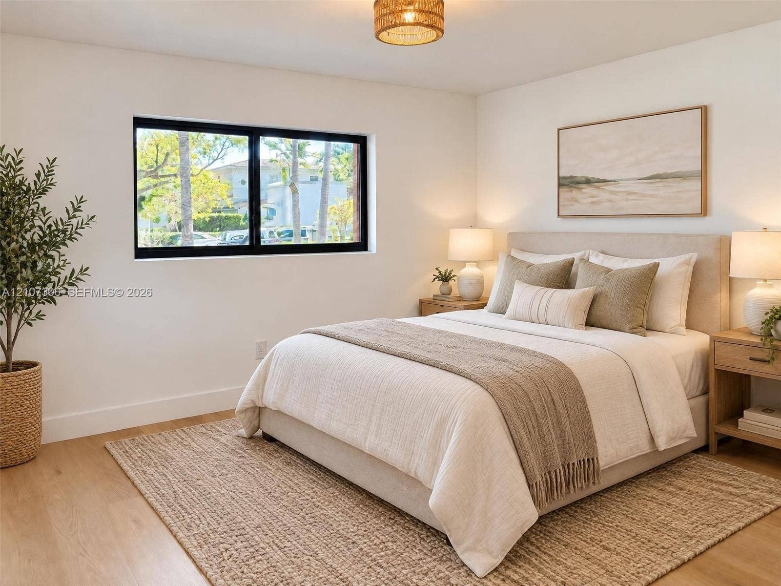 4322 Alton Road, Miami Beach, FL 33140 Neutral-toned room with wood-finish flooring, black-framed window, and woven drum ceiling light fixture