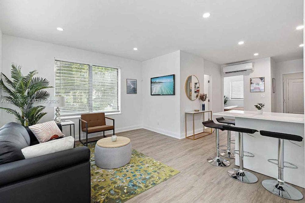 830 9th Street, #14, Miami Beach, Miami Beach, FL 33139 Open-concept interior featuring light wood-finish flooring, recessed lighting, and a kitchen island with a neutral countertop