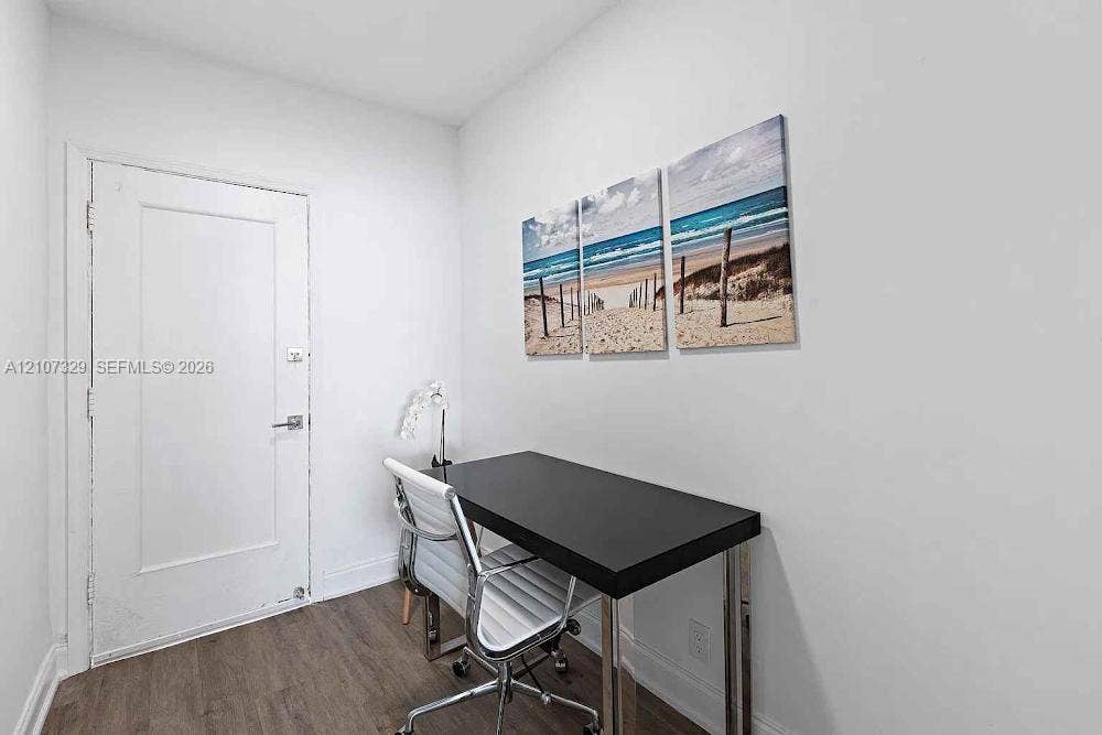 830 9th Street, #14, Miami Beach, Miami Beach, FL 33139 Interior room featuring wood-finish flooring and a white shaker-style door with brushed metal hardware