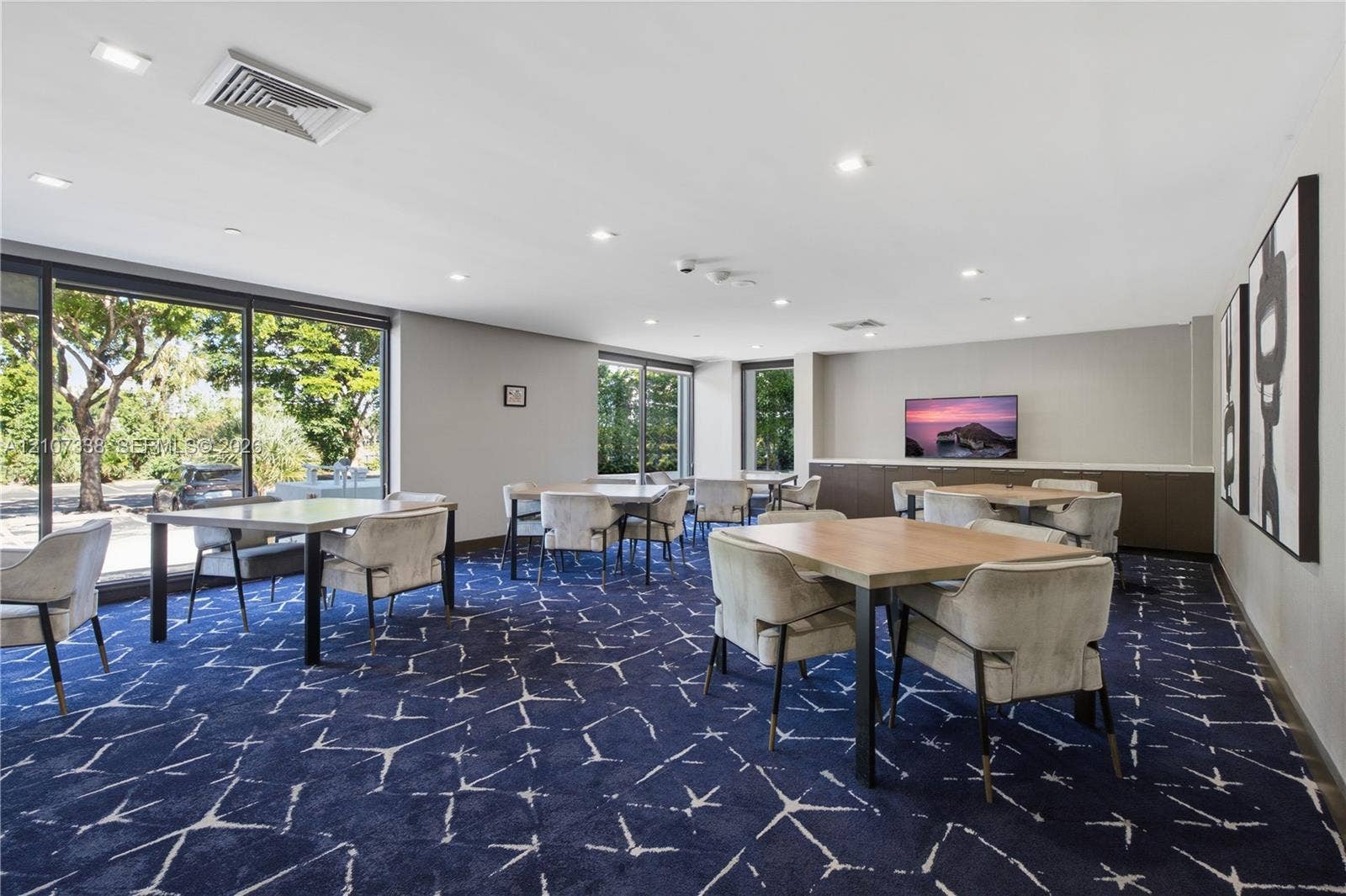 20355 NE 34th Court, #1824, Aventura, FL 33180 Multipurpose common area featuring expansive floor-to-ceiling glass windows, recessed ceiling lighting, and built-in cabinetry
