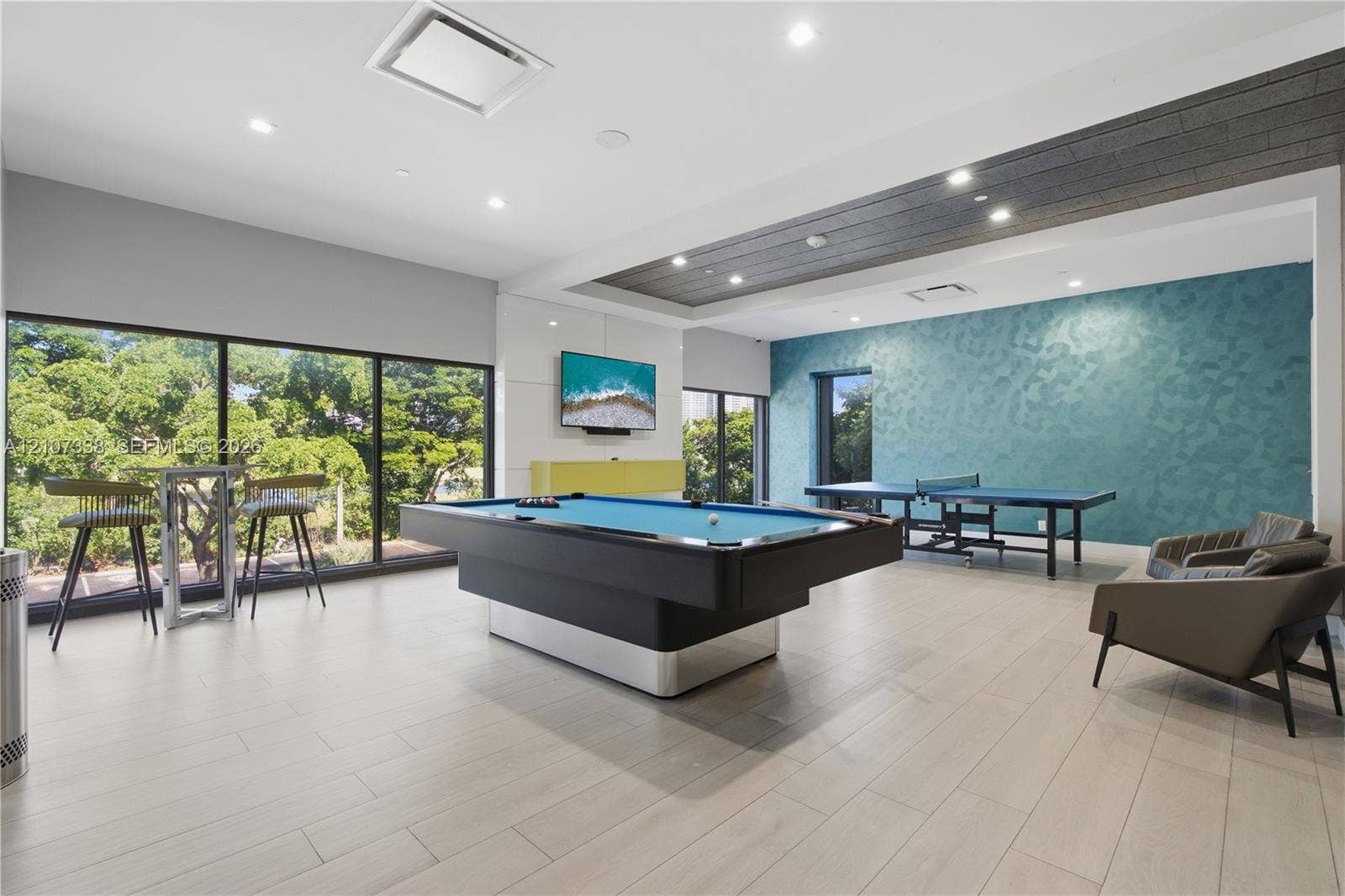 20355 NE 34th Court, #1824, Aventura, FL 33180 Recreation room featuring floor-to-ceiling windows, wood-finish flooring, recessed lighting, and a coffered ceiling with wood-plank detailing