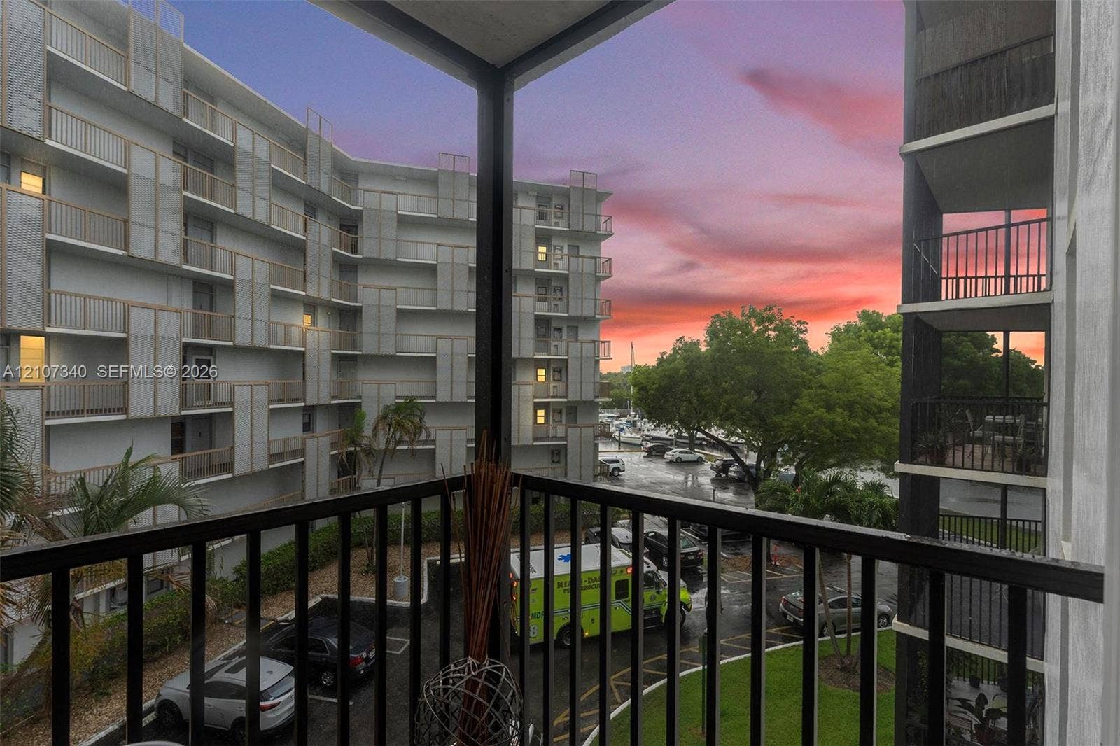 3401 N Country Club Drive, #406, Aventura, Aventura, FL 33180 Covered private balcony featuring black metal railings and overhead lighting