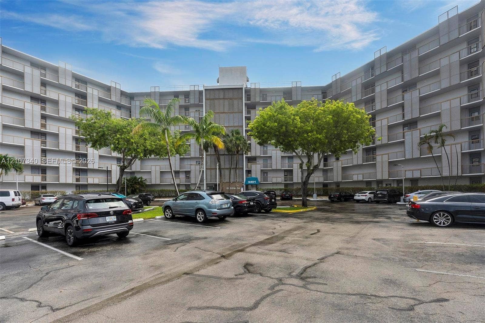 3401 N Country Club Drive, #406, Aventura, Aventura, FL 33180 Multi-story residential building featuring a concrete faade with structural architectural screening and external balcony access
