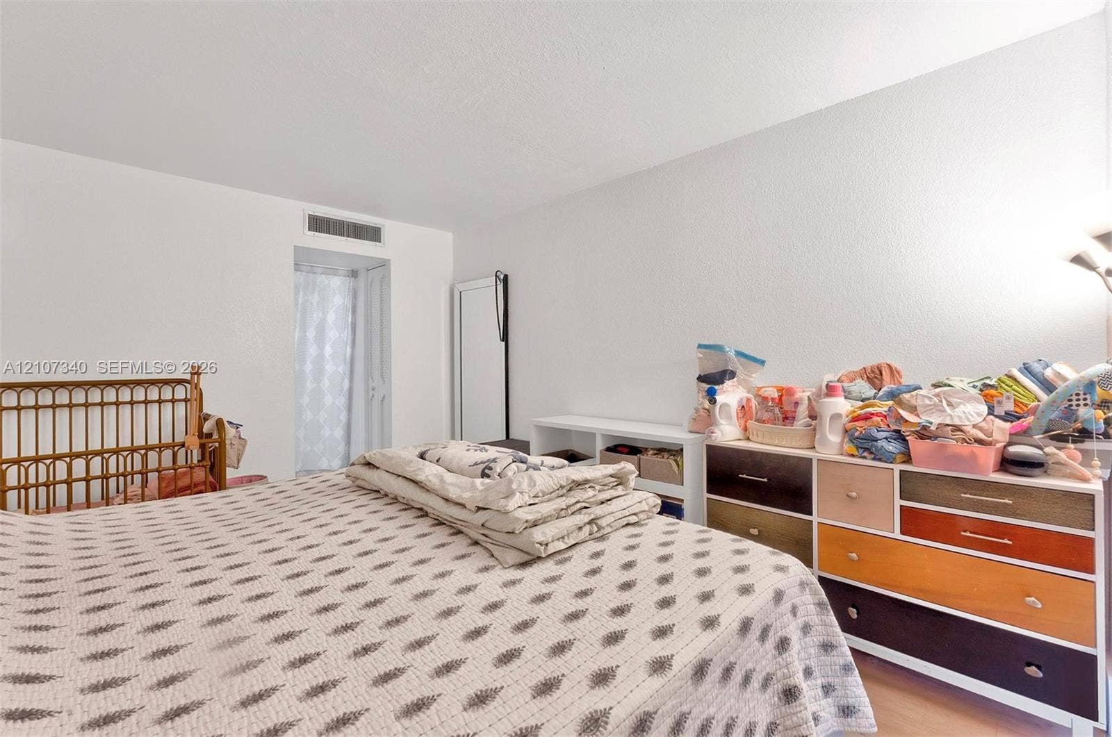 3401 N Country Club Drive, #406, Aventura, Aventura, FL 33180 Room interior featuring white walls, wood-finish flooring, and a doorway leading to a private area
