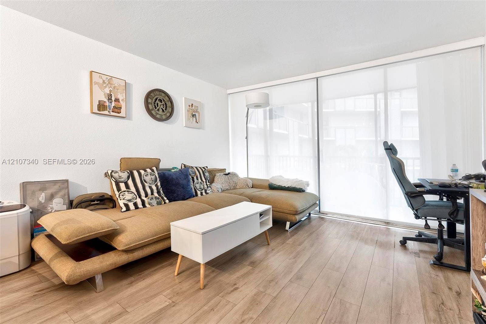 3401 N Country Club Drive, #406, Aventura, Aventura, FL 33180 Wood-finish flooring and floor-to-ceiling sliding glass doors with integrated roller shades