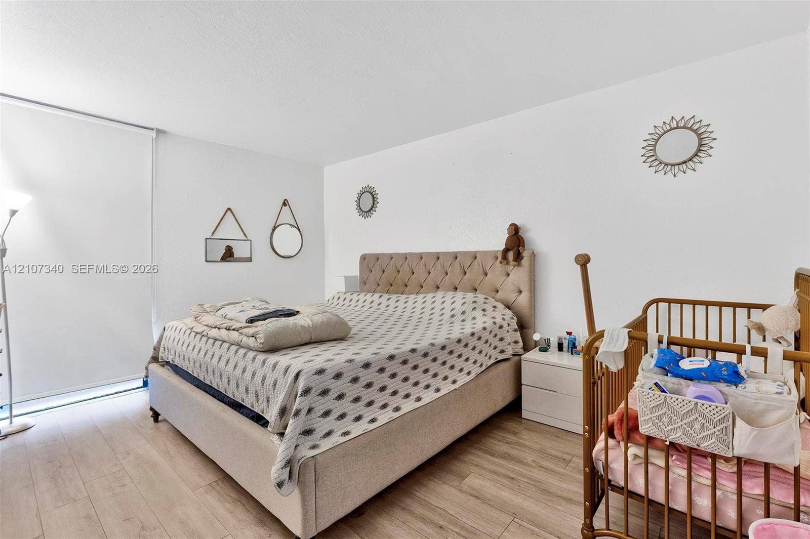 3401 N Country Club Drive, #406, Aventura, Aventura, FL 33180 Wood-finish flooring and a full-height window with an integrated roller shade