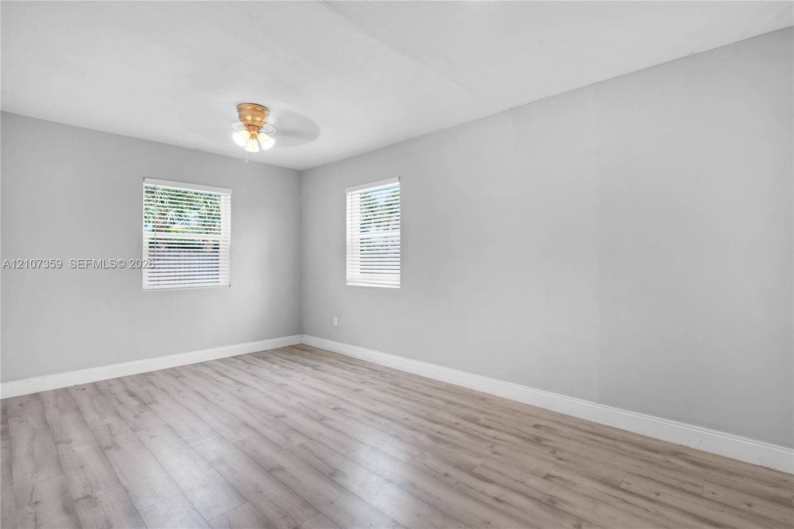 4500 NE 18th Avenue, Pompano Beach, Pompano Beach, FL 33064 Bright bedroom with multiple windows, neutral finishes, and updated flooring.