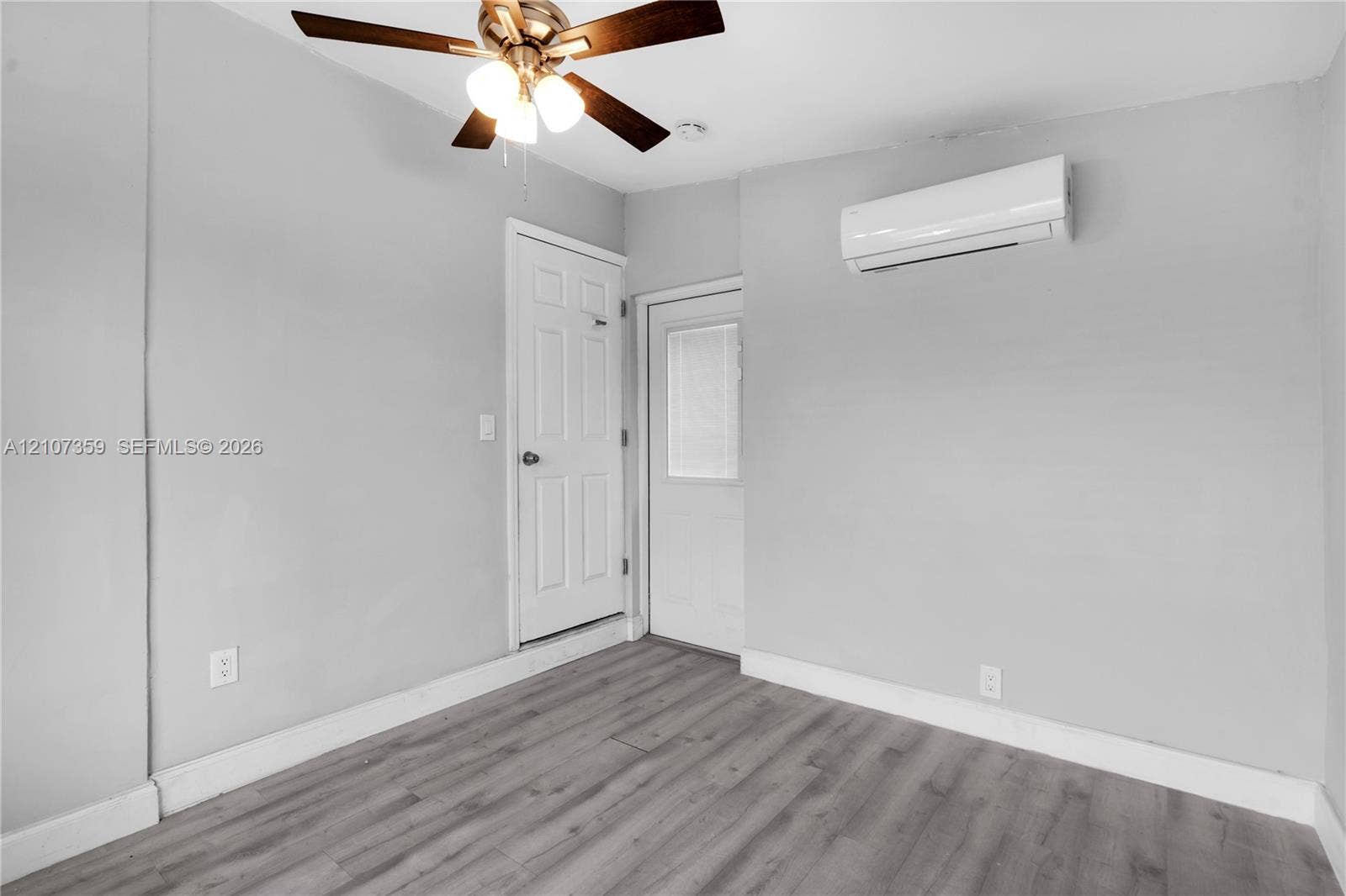 4500 NE 18th Avenue, Pompano Beach, Pompano Beach, FL 33064 Bedroom featuring a mini-split A/C unit and ceiling fan.