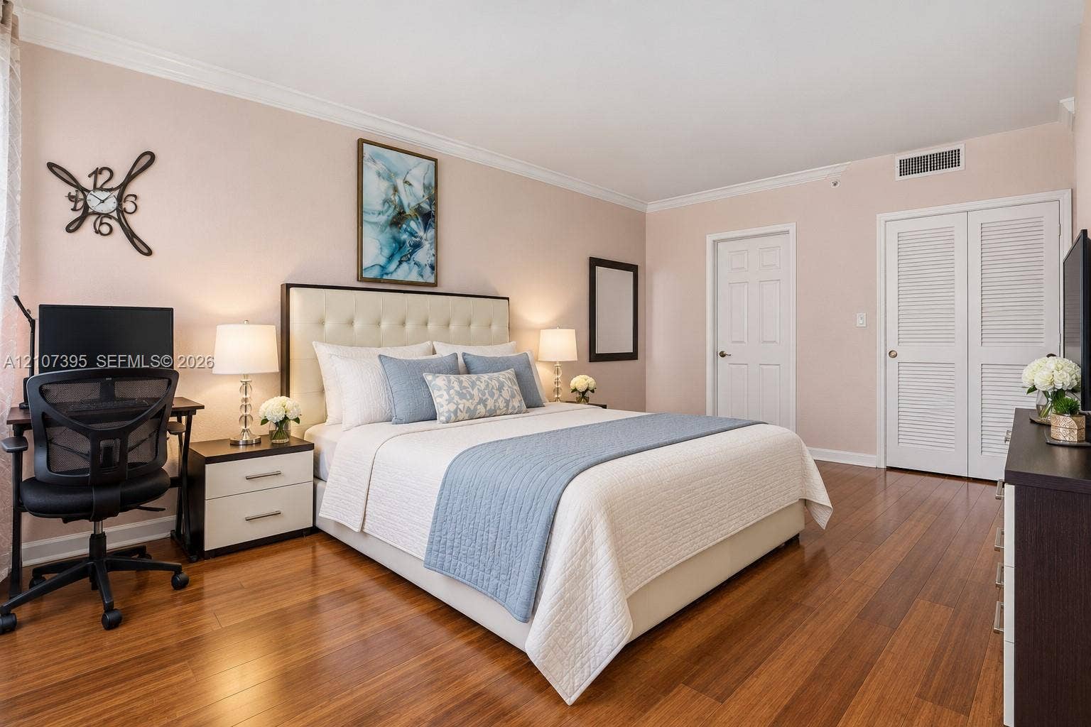 Wood-finish flooring, crown molding, and dual louvered closet doors