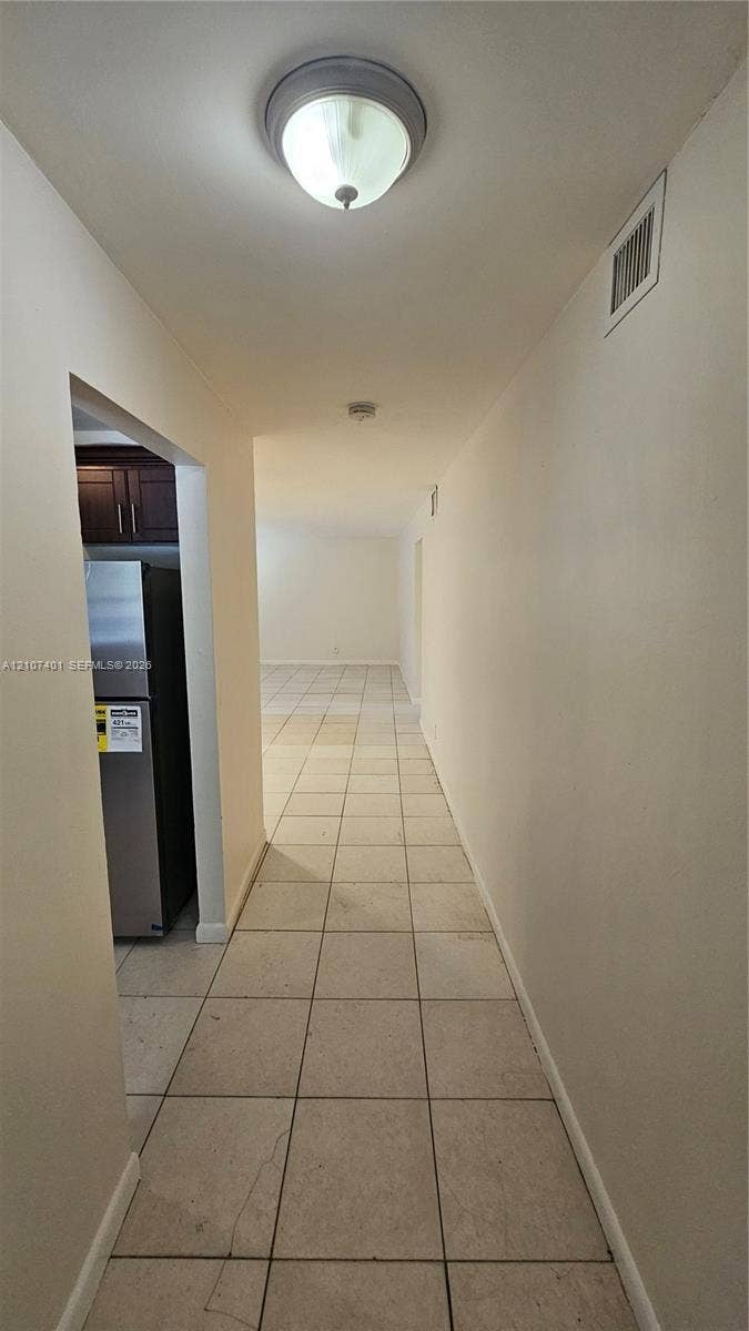 1524 SW 5th Place, #C, Fort Lauderdale, Fort Lauderdale, FL 33312 Neutral-toned ceramic tile flooring throughout, featuring a flush-mount ceiling light fixture