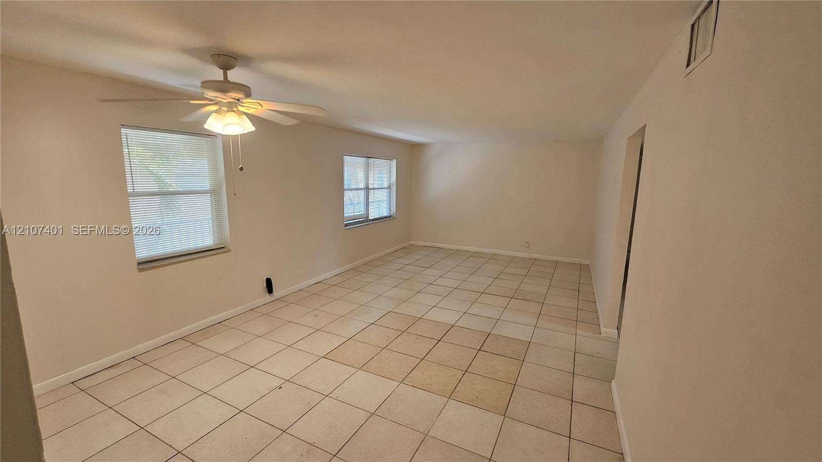 1524 SW 5th Place, #C, Fort Lauderdale, Fort Lauderdale, FL 33312 Interior space featuring ceramic tile flooring, neutral wall paint, and a ceiling fan with integrated lighting