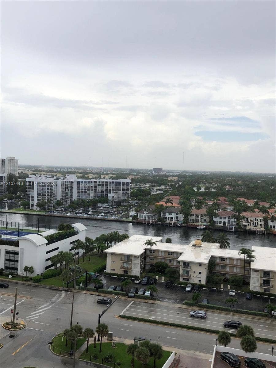 2301 S Ocean Drive, #1606, Hollywood, Hollywood, FL 33019 Elevated perspective featuring extensive water frontage, palm-lined residential streets, and horizon-spanning cityscape