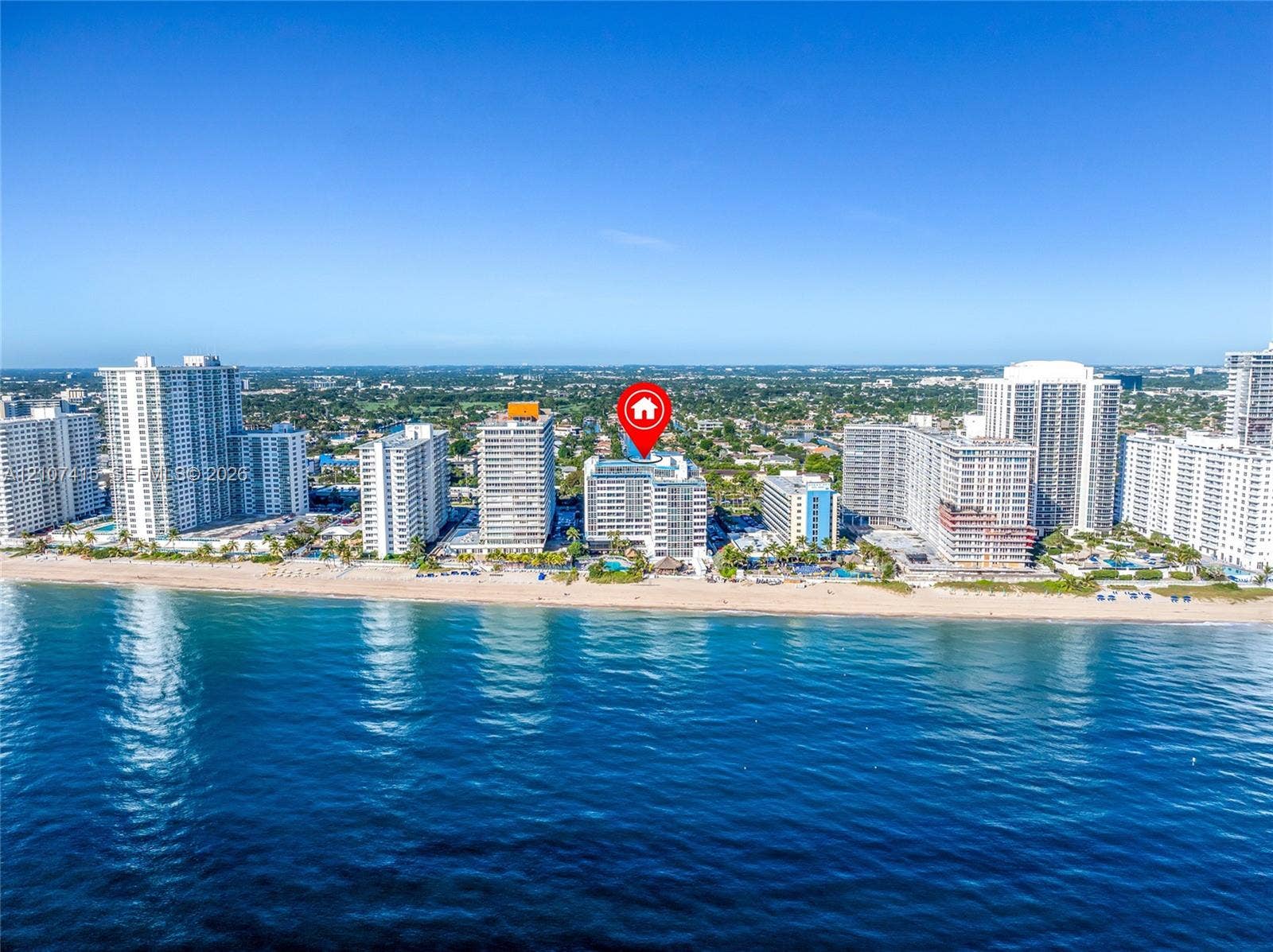 High-rise residential building situated on the Atlantic coastline featuring direct beach access and an outdoor swimming pool