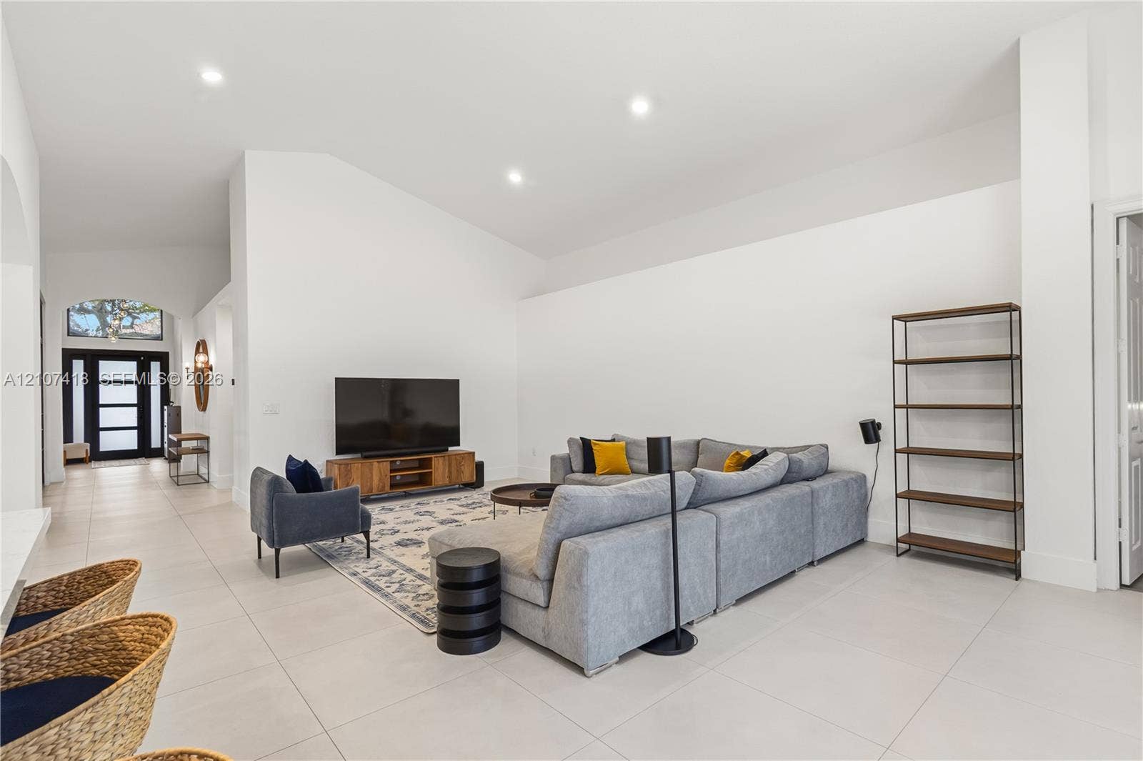 19305 Skyridge Circle, #n/a, Boca Raton, Boca Raton, FL 33498 Vaulted ceilings, neutral ceramic tile flooring, recessed lighting, and a multi-pane glass entry door