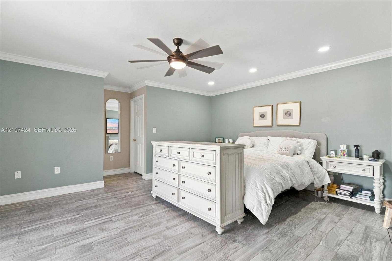 14702 Vista Luna Drive, Davie, FL 33325 Oversized bedroom featuring recessed lighting, crown molding, wood-finish tile flooring, and a multi-blade ceiling fan