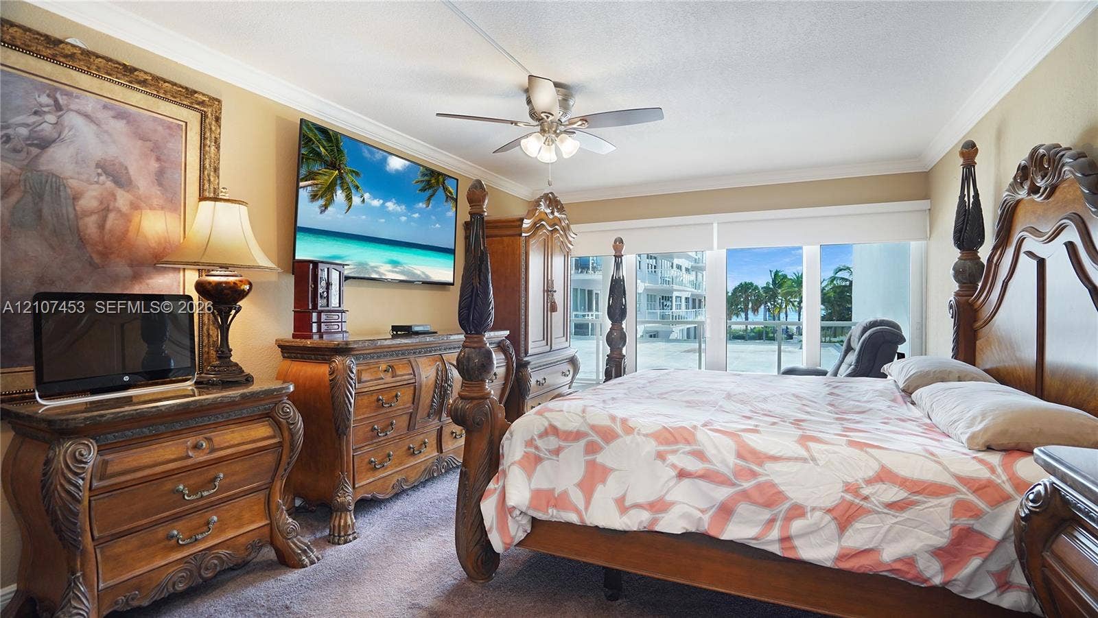 111 N Pompano Beach Boulevard, #304, Pompano Beach, FL 33062 Bedroom featuring wall-to-wall carpeting, ceiling fan with integrated lighting, crown molding, and floor-to-ceiling windows with balcony access