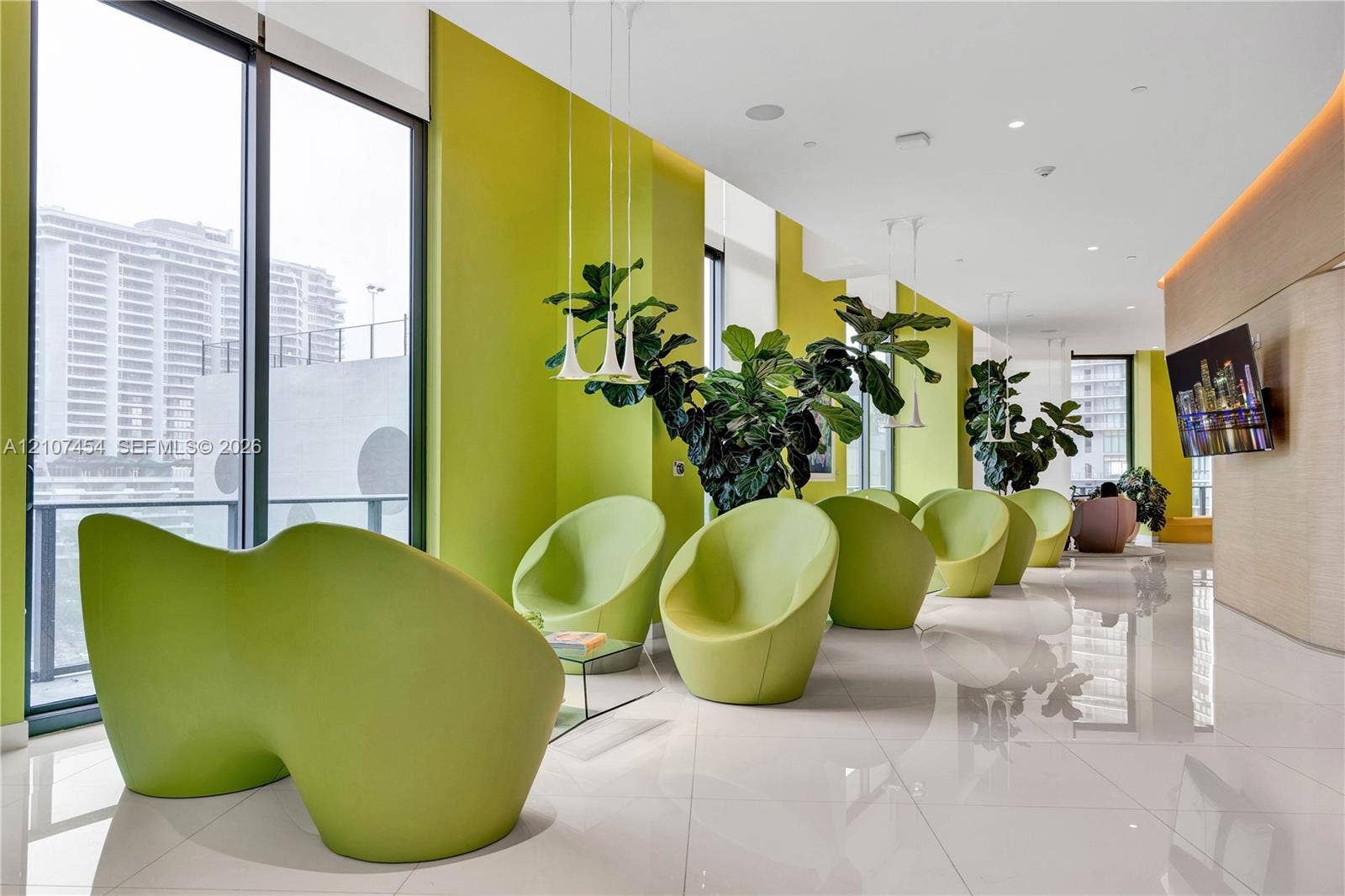 501 NE 31st Street, #1906, Miami, FL 33137 Floor-to-ceiling windows, polished tile flooring, recessed ceiling lighting, and suspended pendant fixtures