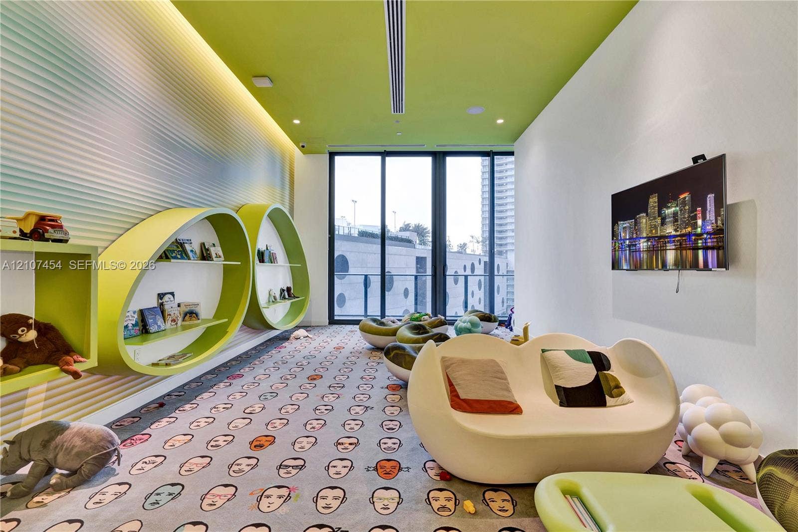 501 NE 31st Street, #1906, Miami, FL 33137 Custom interior featuring textured, wave-pattern wall paneling, built-in elliptical shelving, a linear recessed ceiling fixture, and floor-to-ceiling glass sliding doors