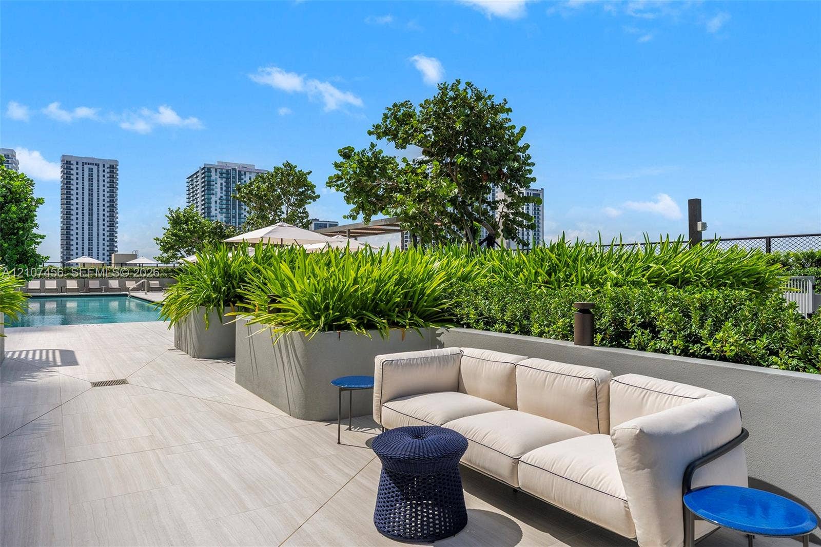1400 Biscayne Boulevard, #2604, Miami, Miami, FL 33132 Rooftop terrace featuring large-format tile flooring, integrated concrete planters, and a swimming pool