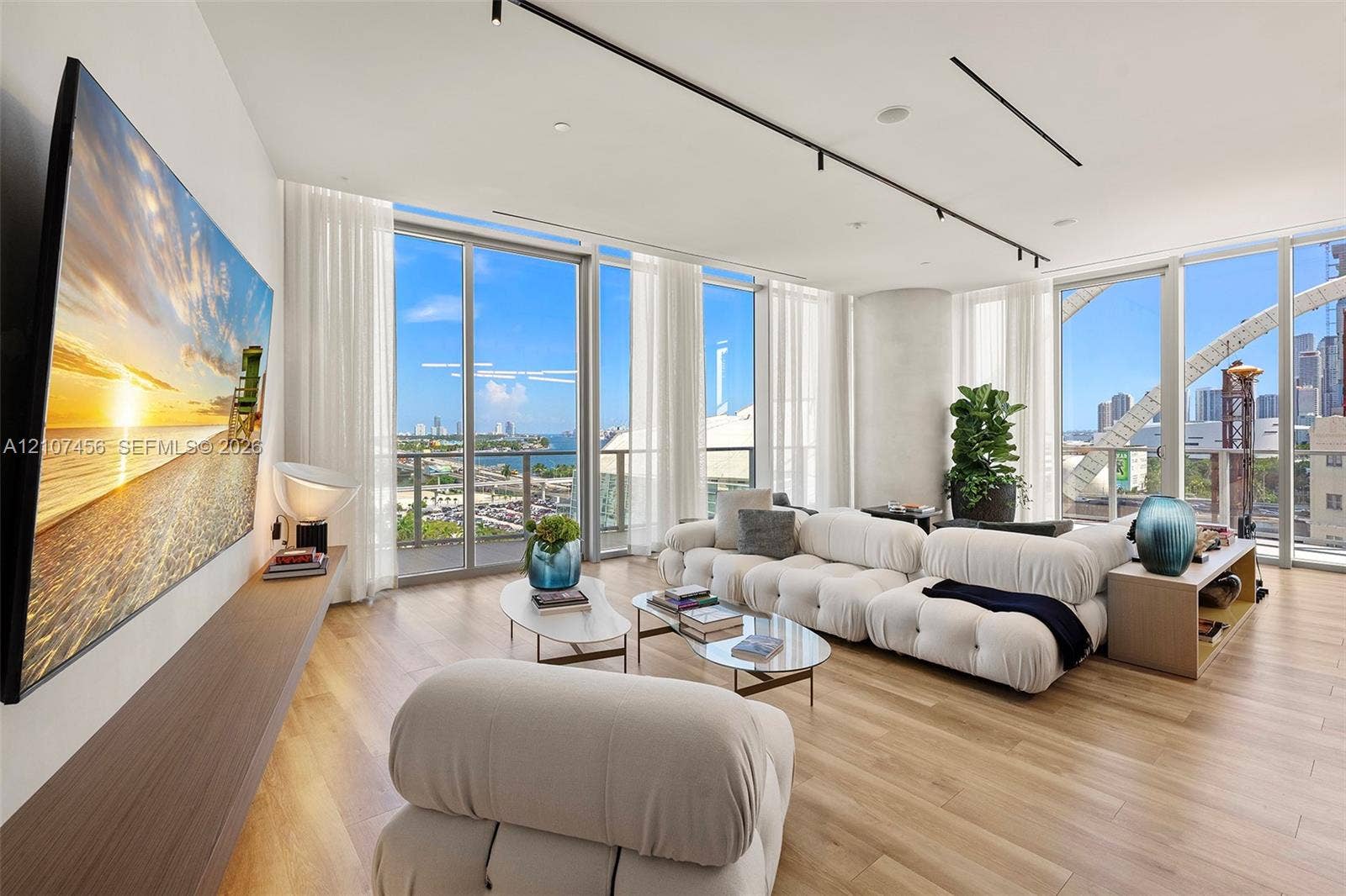 1400 Biscayne Boulevard, #2604, Miami, Miami, FL 33132 Floor-to-ceiling windows, wood-finish flooring, custom wall-mounted shelving, and recessed track lighting