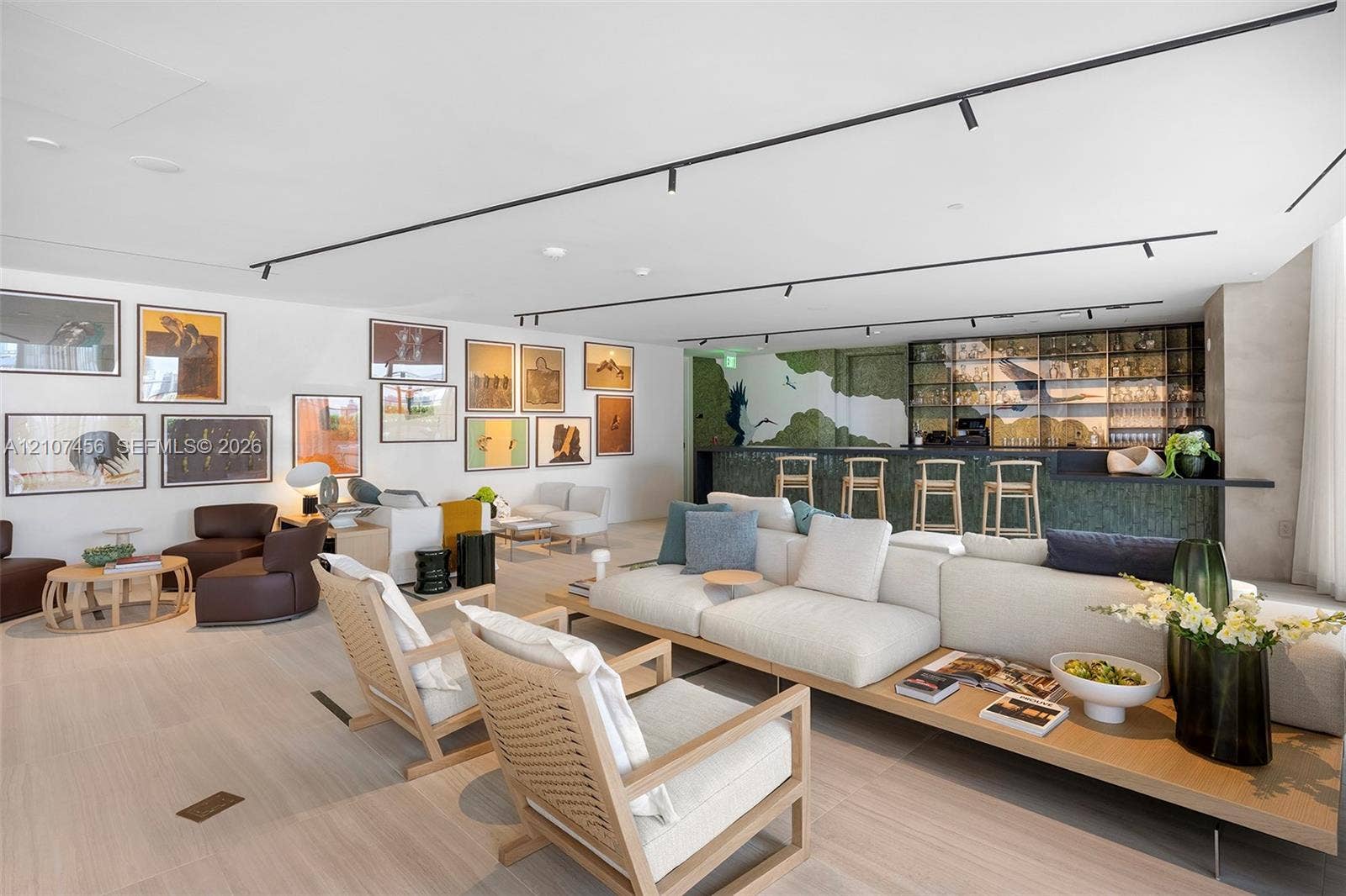 1400 Biscayne Boulevard, #2604, Miami, Miami, FL 33132 Open-concept living space featuring wood-finish flooring, recessed track lighting, and a built-in bar with glass-front cabinetry