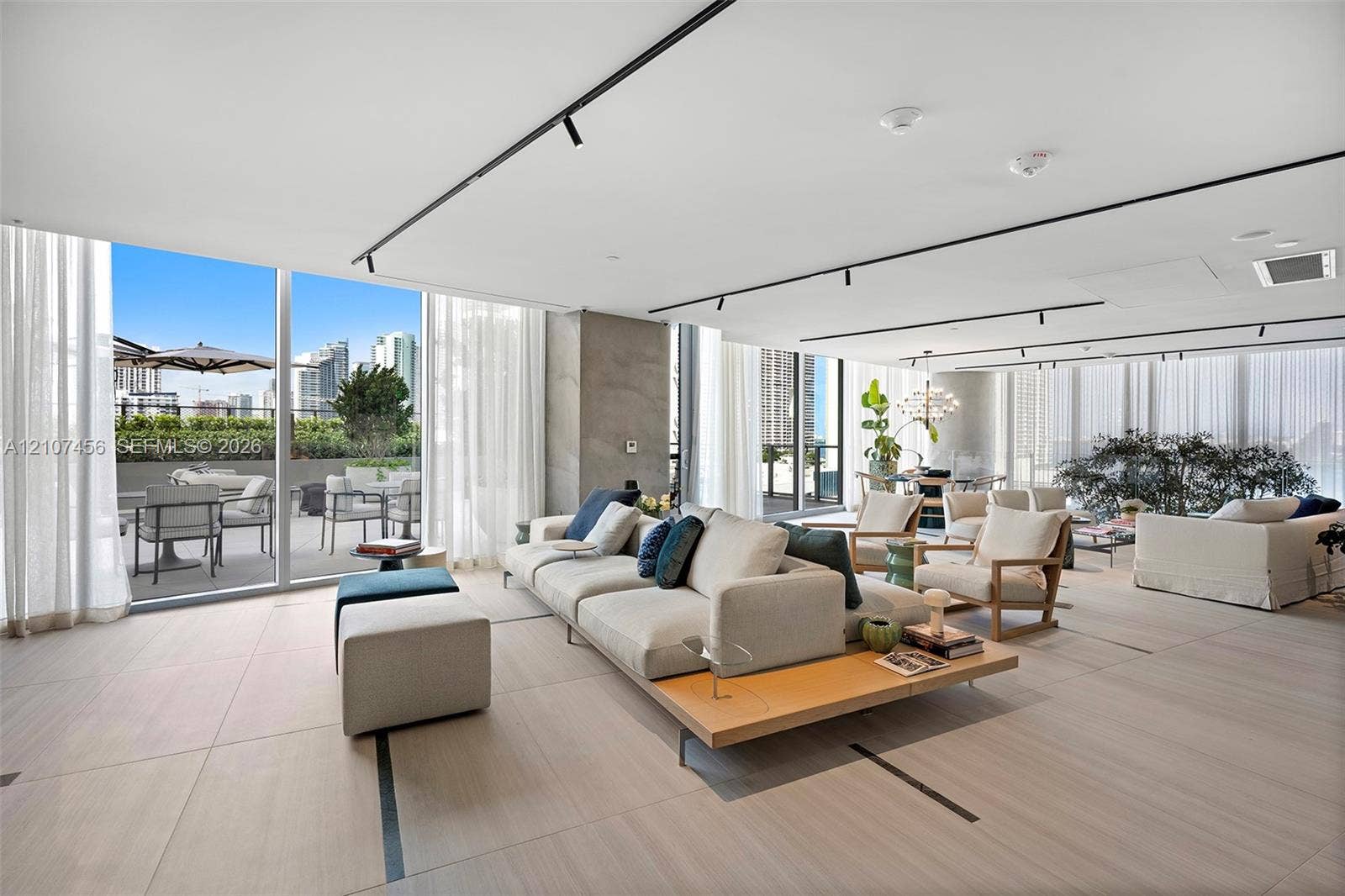 1400 Biscayne Boulevard, #2604, Miami, Miami, FL 33132 Large-format tile flooring, floor-to-ceiling glass walls, integrated track lighting, and a private terrace