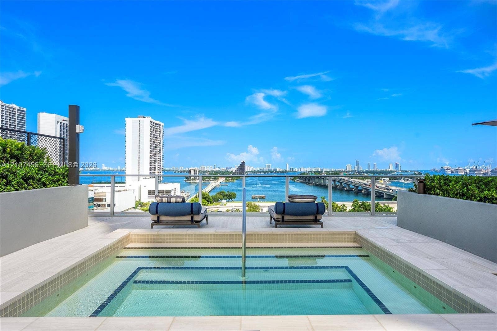 1400 Biscayne Boulevard, #2604, Miami, Miami, FL 33132 Rooftop terrace featuring an in-ground spa, tiled deck, metal railing, and integrated landscaping