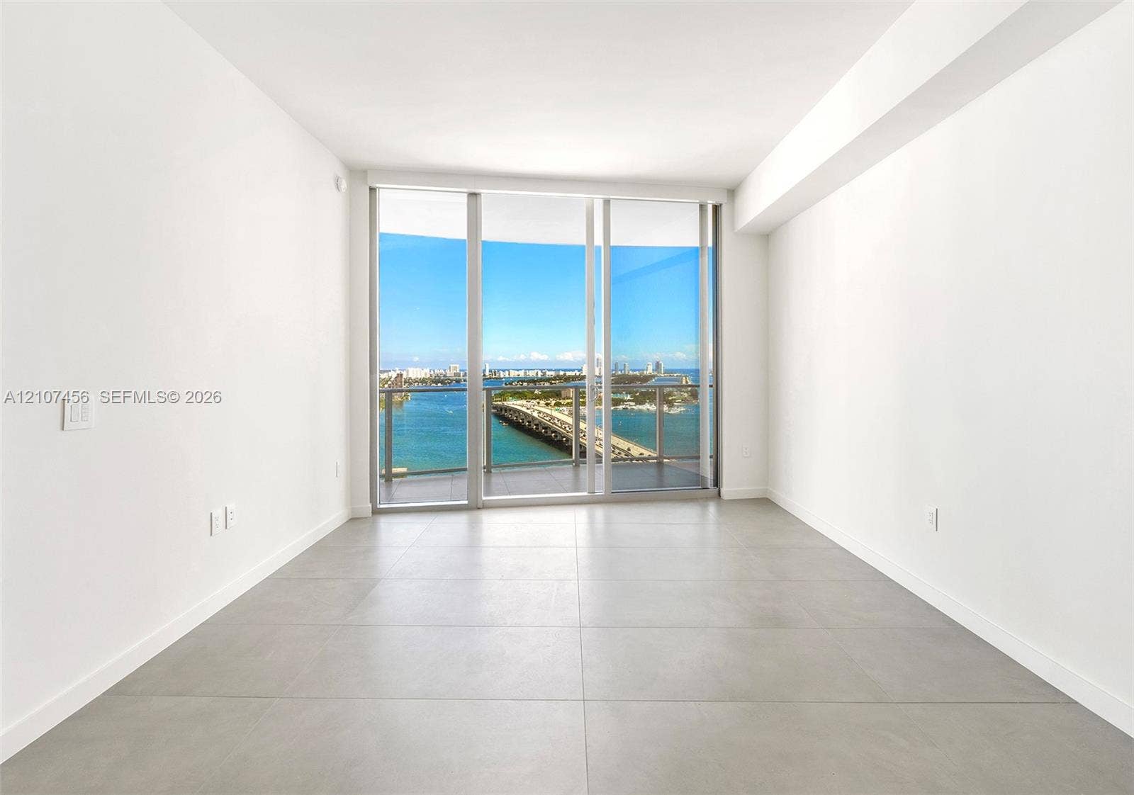 1400 Biscayne Boulevard, #2604, Miami, Miami, FL 33132 Floor-to-ceiling glass windows, private balcony, and large-format tile flooring