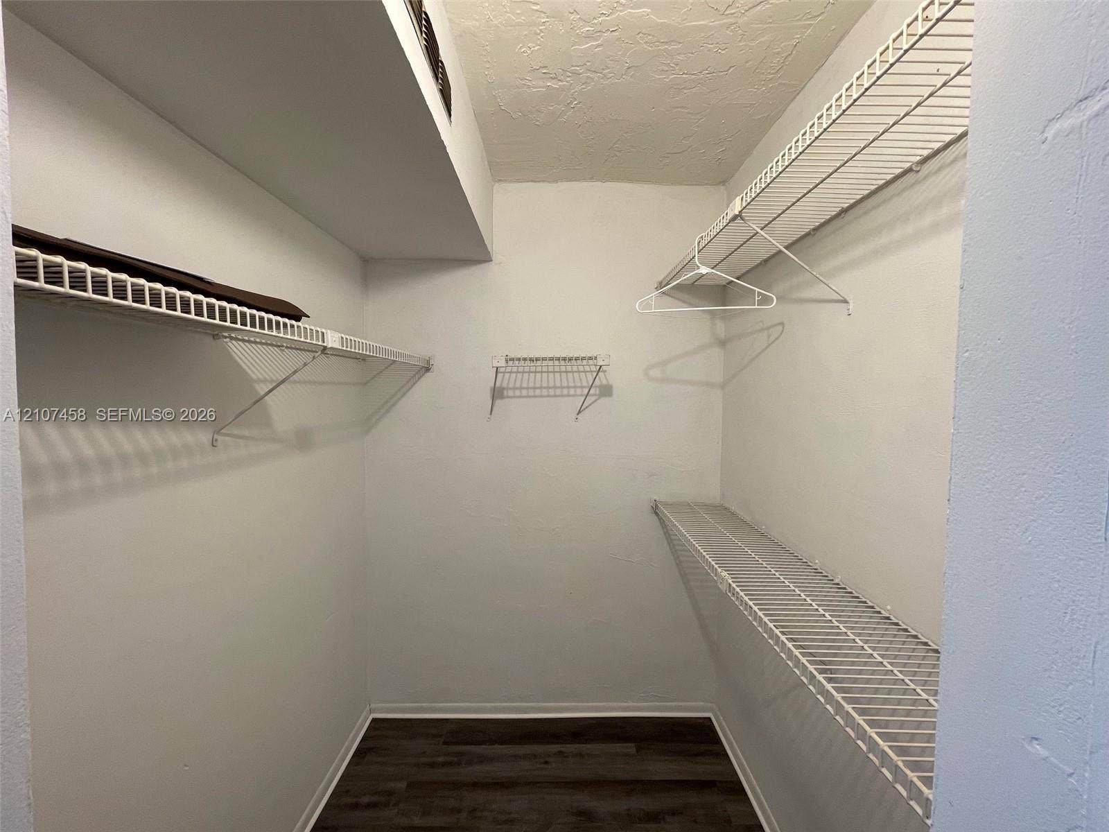 7300 NW 17th Street, #421, Plantation, Plantation, FL 33313 Walk-in storage space featuring wood-finish flooring and tiered white wire shelving