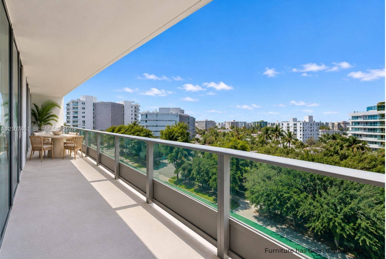 9201 E Bay Harbor Drive, #602, Bal Harbour, FL 33141 Covered terrace featuring a glass and metal railing, concrete flooring, and an expansive urban canopy skyline
