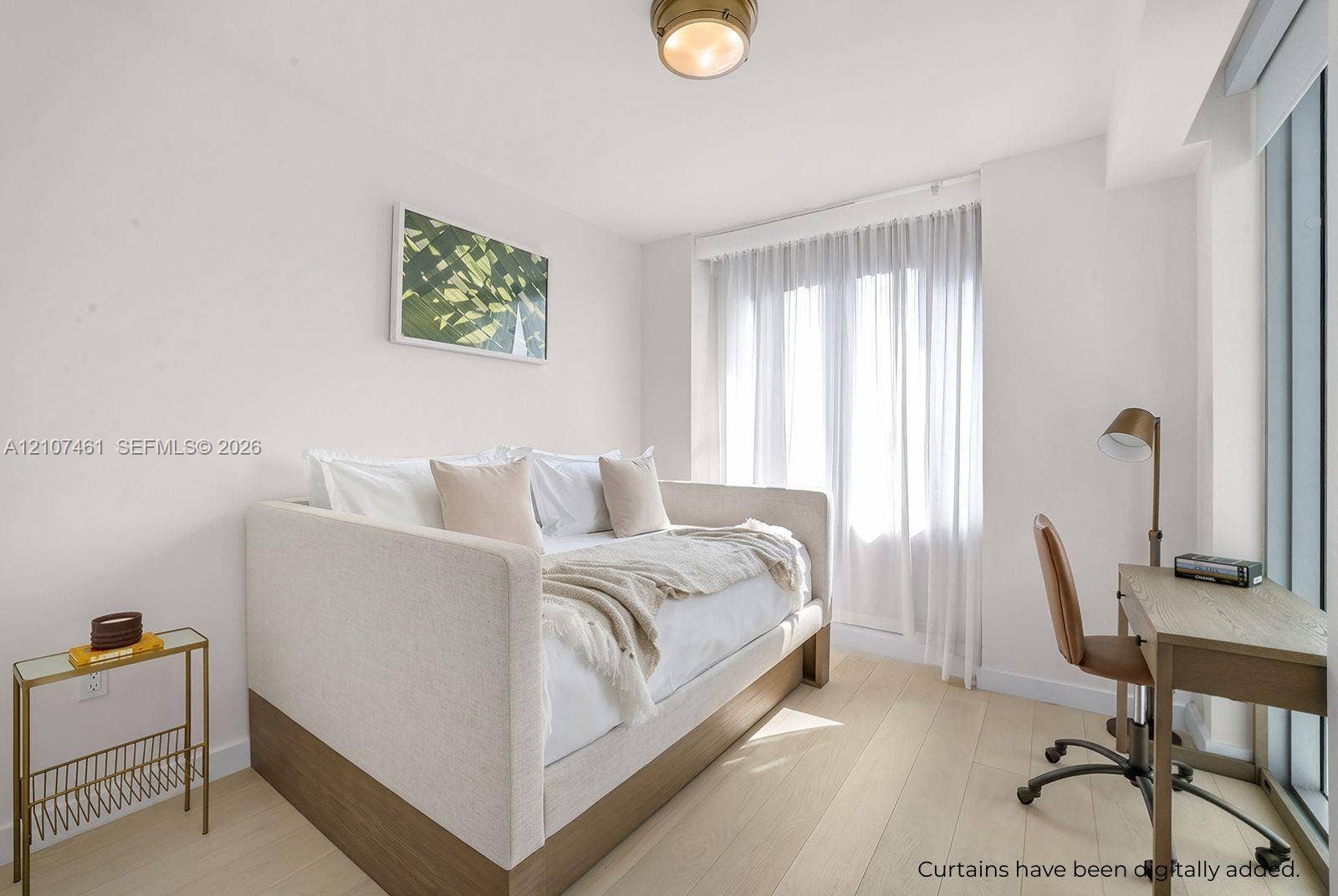 9201 E Bay Harbor Drive, #602, Bal Harbour, FL 33141 Light-filled room featuring wood-finish flooring, floor-to-ceiling windows, and a flush-mount brass-finish light fixture