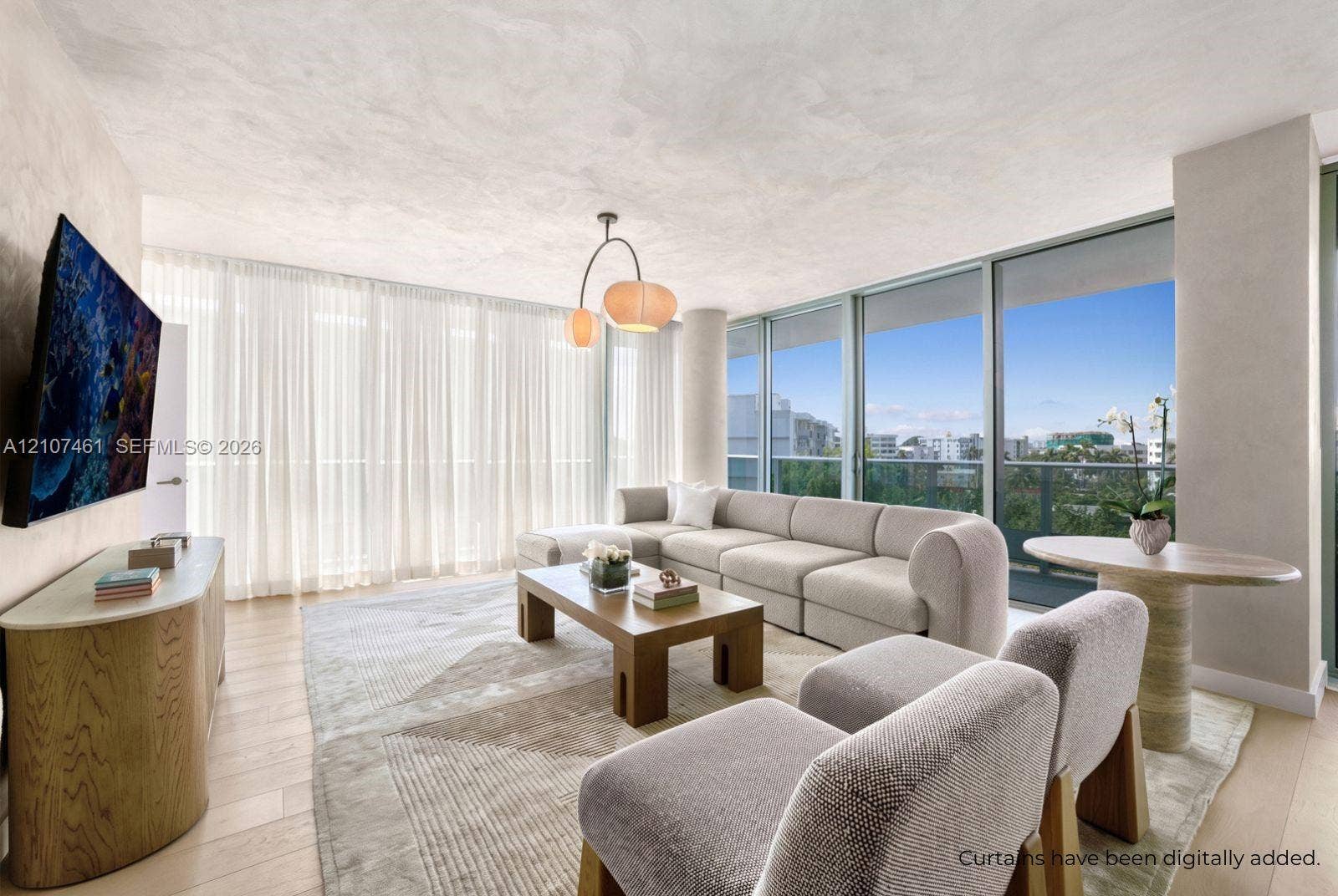 9201 E Bay Harbor Drive, #602, Bal Harbour, FL 33141 Living space featuring floor-to-ceiling glass paneling, wood-finish flooring, custom textured wall finishes, and a multi-pendant light fixture