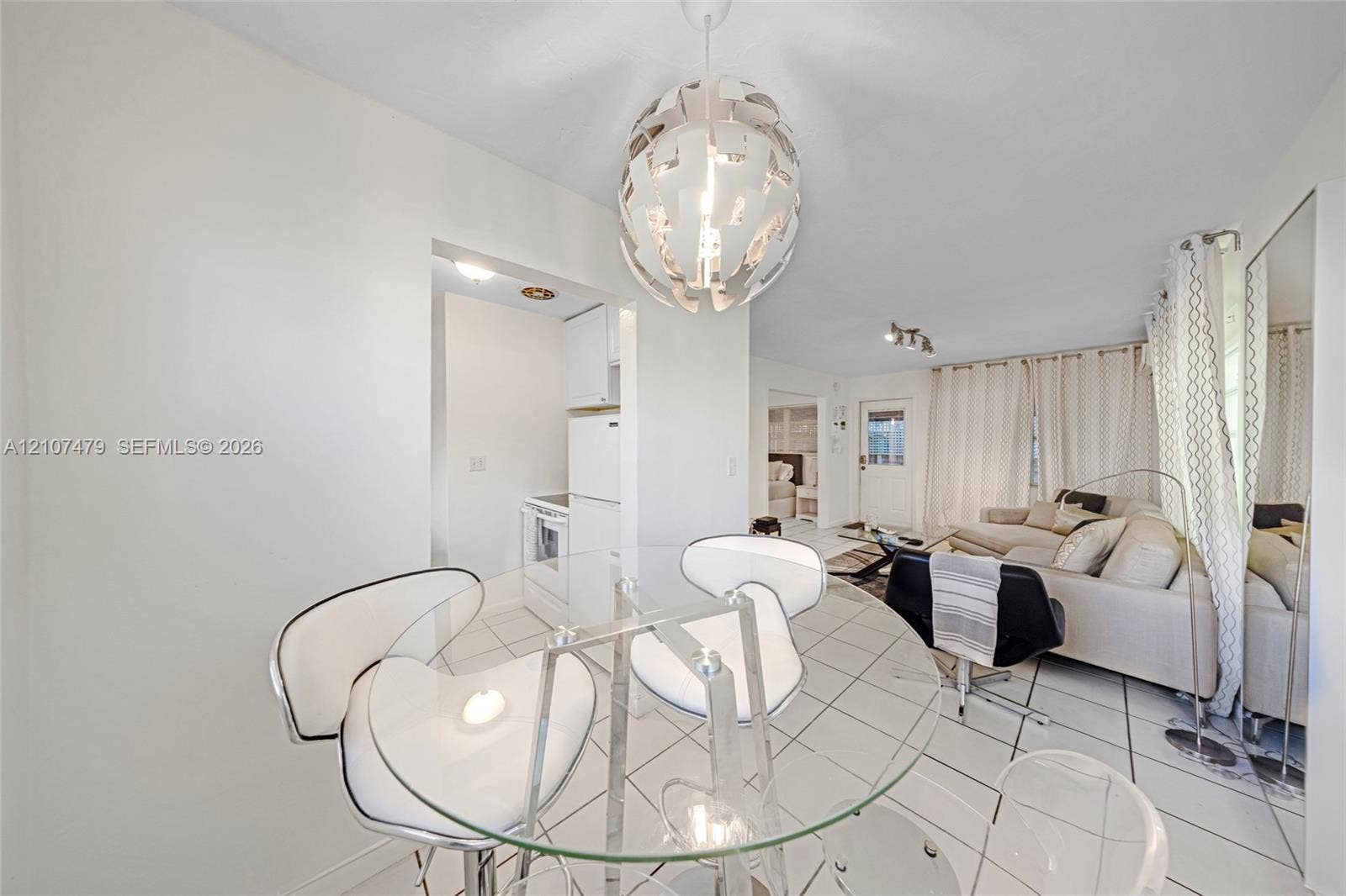 Tiled flooring and large-scale spherical pendant lighting