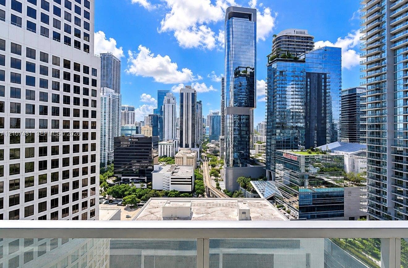 55 SE 6th Street, #2802, Miami, FL 33131 Balcony featuring glass panel railing and panoramic metropolitan skyline scenery