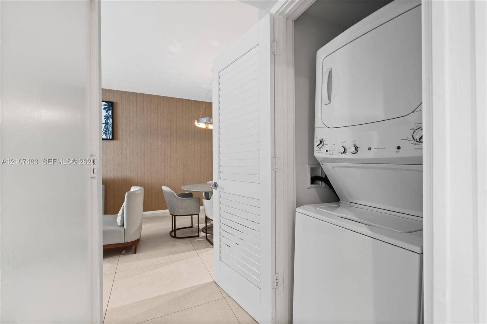 4111 S Ocean Drive, #2407, Hollywood, FL 33019 Stackable laundry unit housed behind a louvered closet door
